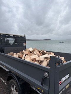 Full tipper of ready to burn logs