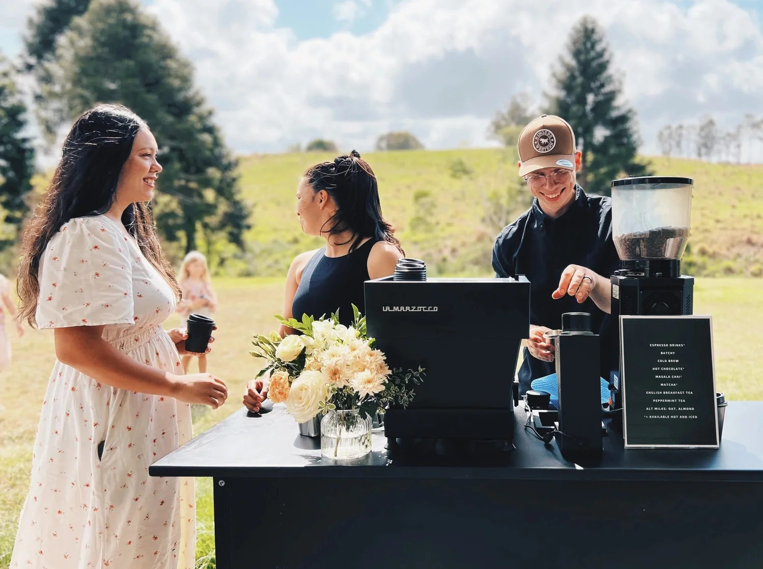 Professional barista serving specialty coffee at a Sunshine Coast wedding