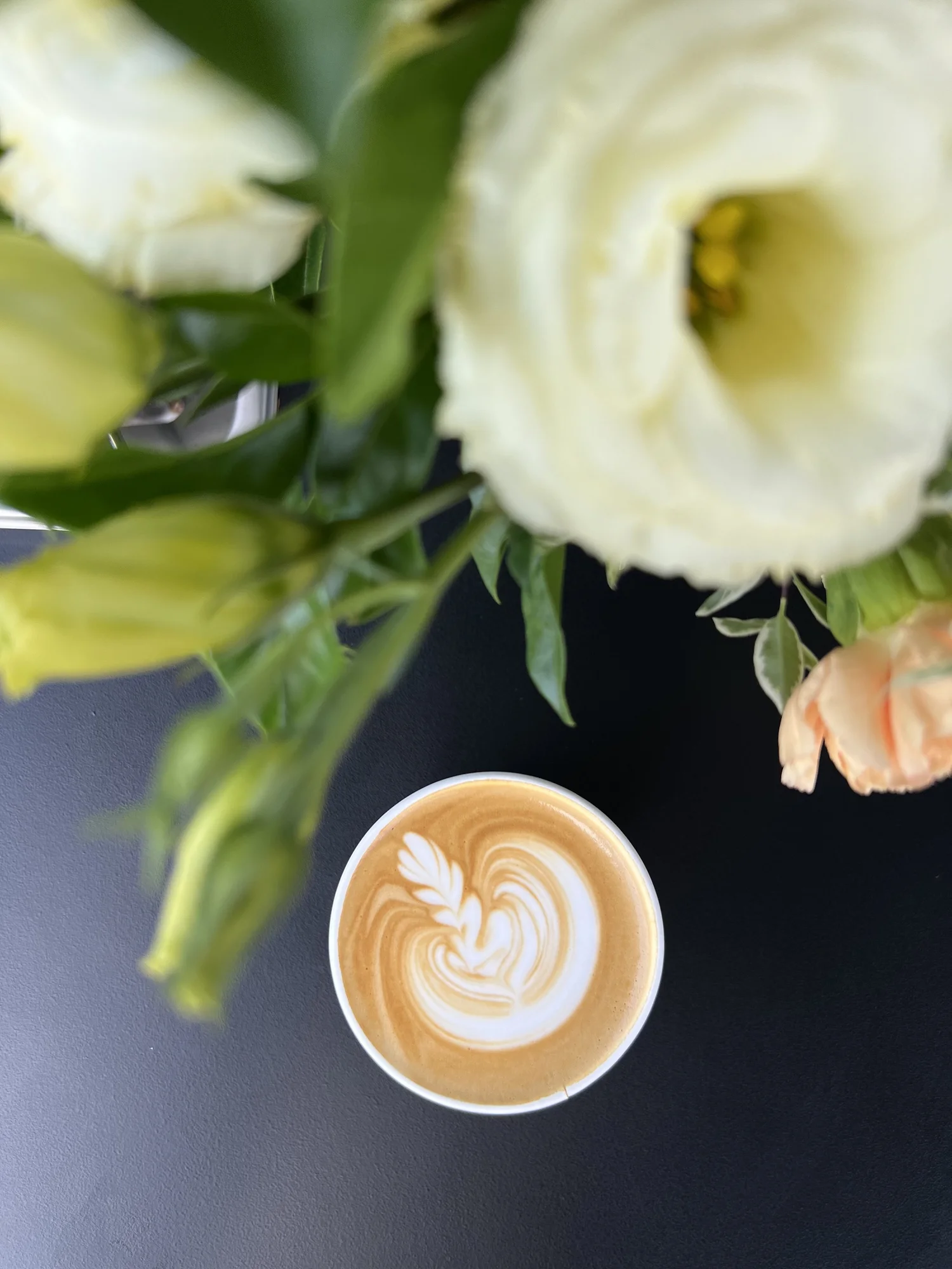 Specialty latte with flowers — The Arc Specialty Coffee wedding