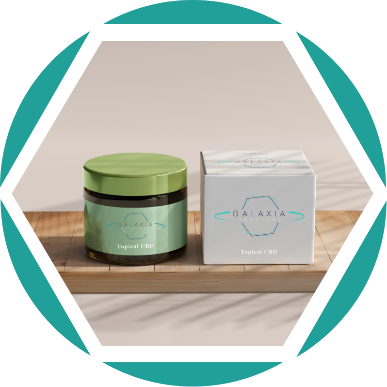 A jar and a box of Galaxia Topical CBD product on a wooden surface.