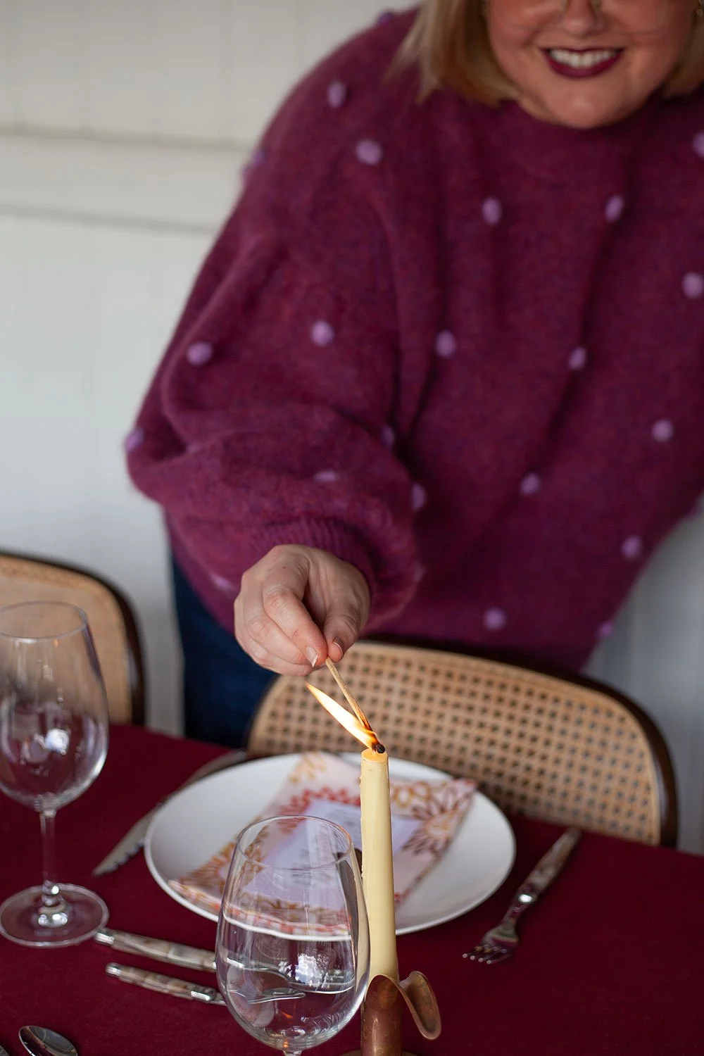 Lighting candle_A Cozy Winter Feast_The Dinner Party Guide.jpg