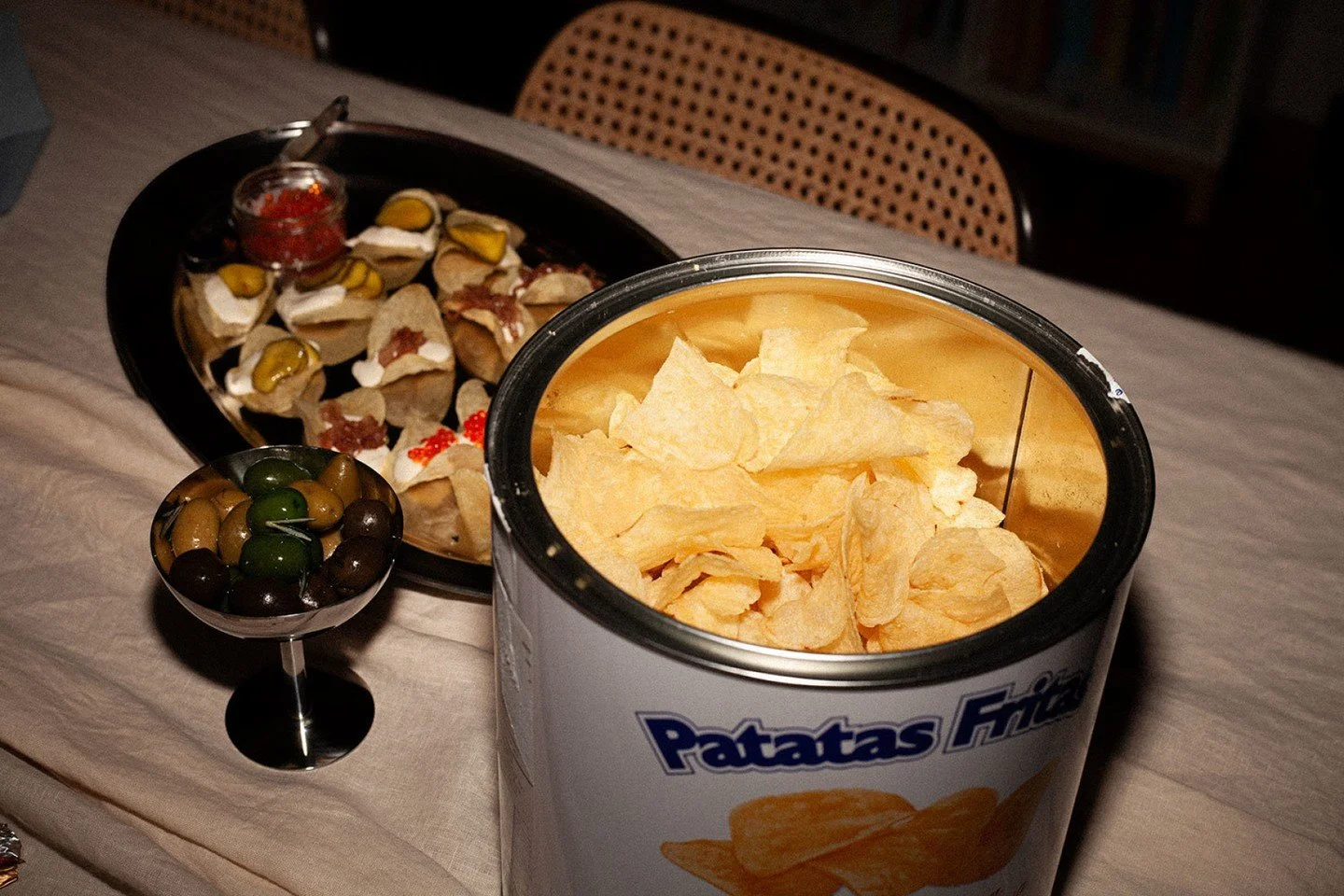 The opening act of My Soir&eacute;e. Cos leaves cradling the dressing you'd happily drink, finished with extra parm and a toasted breadcrumb crunch &mdash; and a chip flight beside them, because nibbles should be a little bit of theatre. Recipe lives