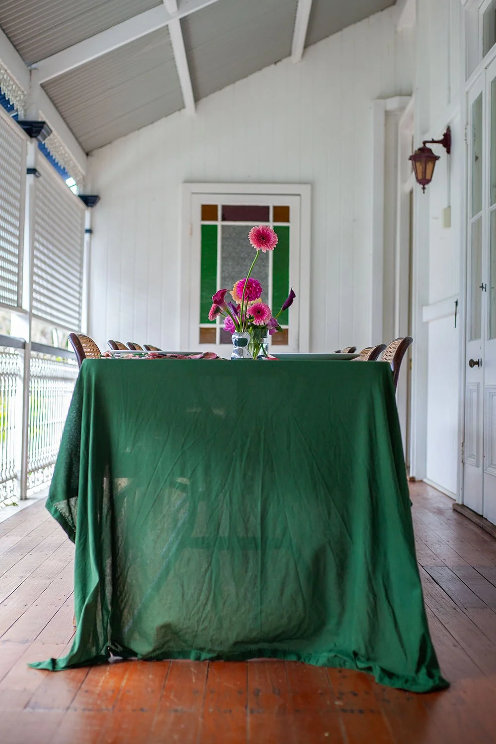 Folding table set up to look like an outdoor table on a balcony