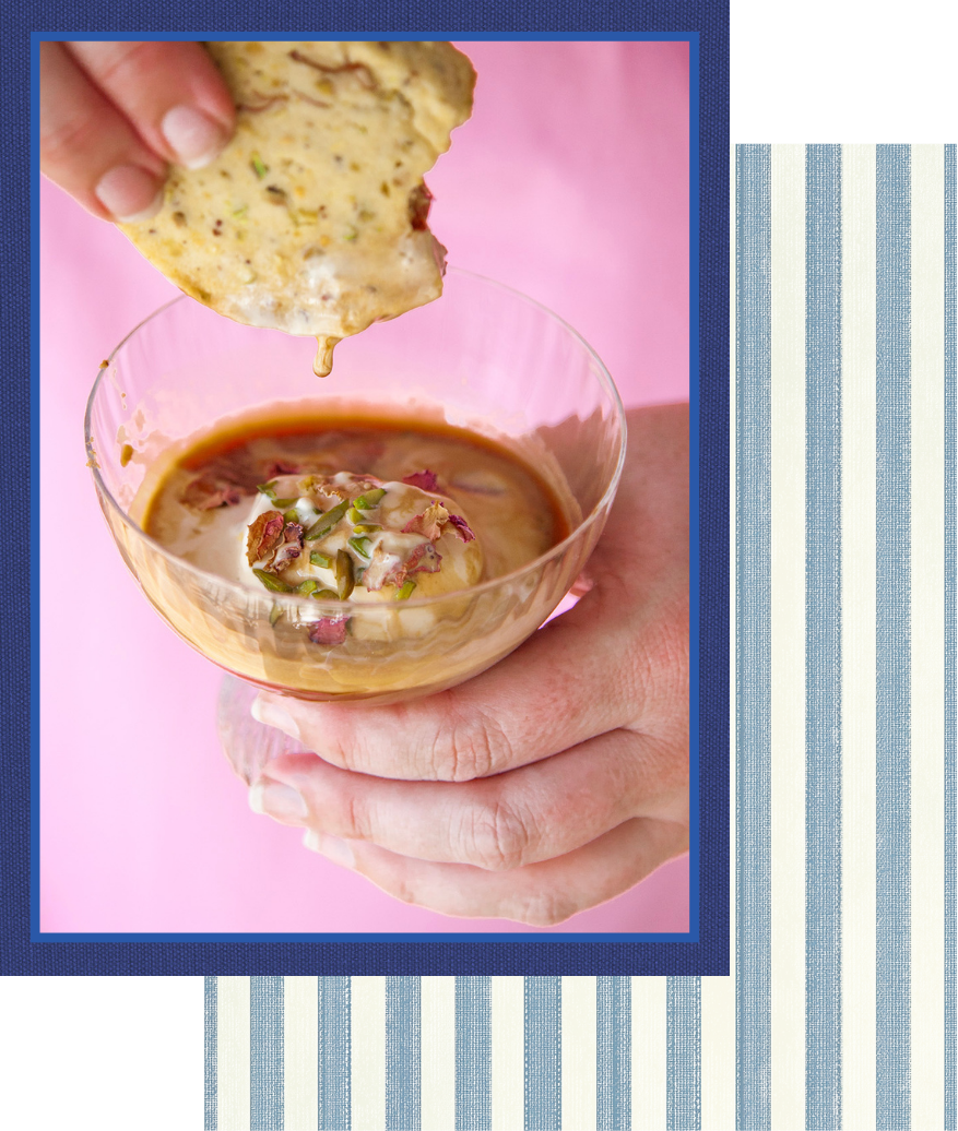 Cookie being dunked into an Affogato with person in pink dress