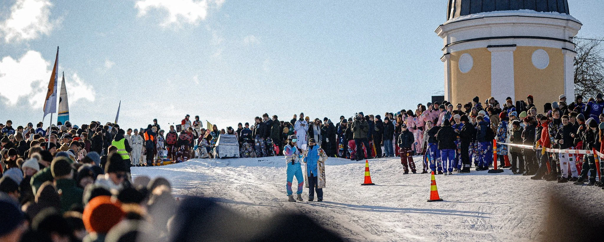 Students racing downhill at Laskiaisrieha in Ullanlinnanmäki, Helsinki