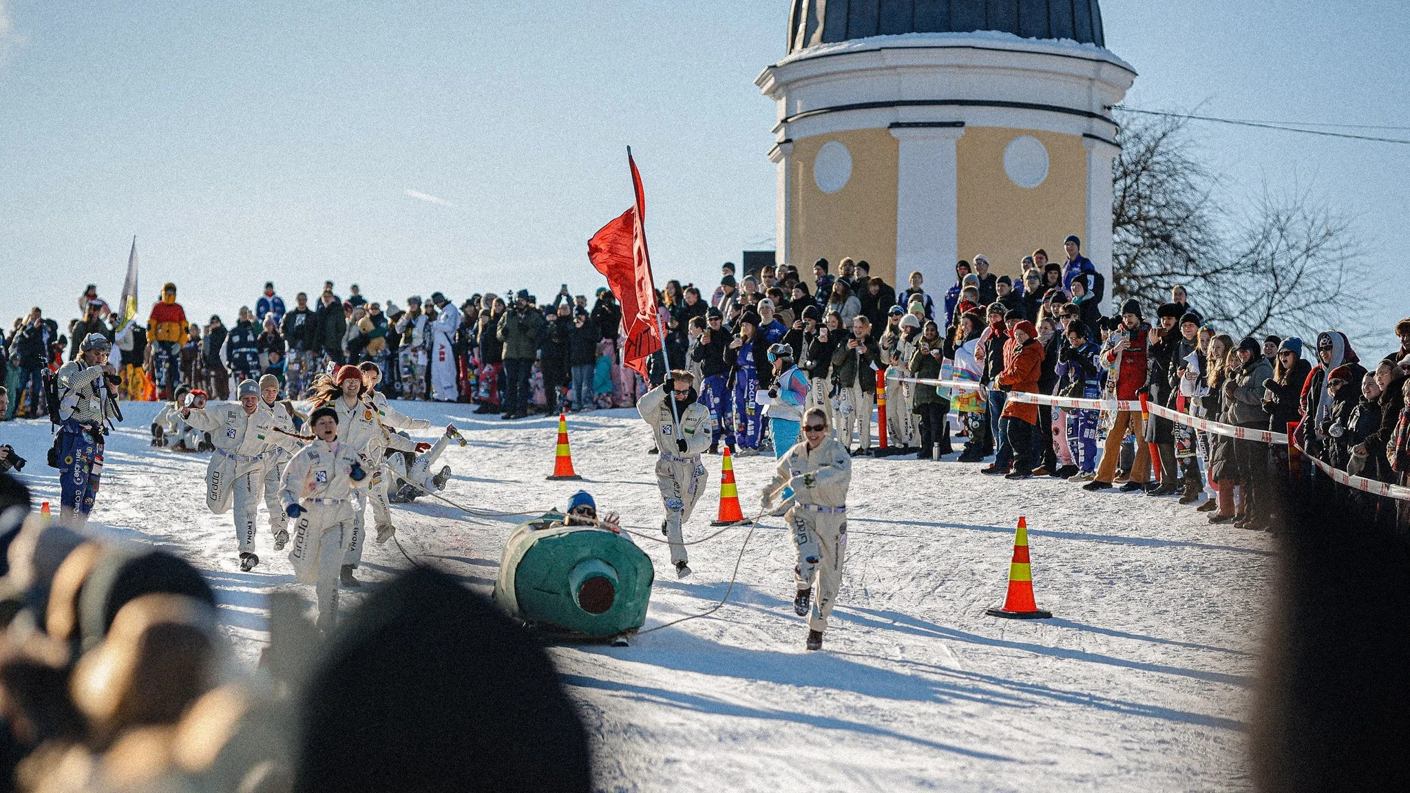 Students racing downhill at Laskiaisrieha in Ullanlinnanmäki, Helsinki