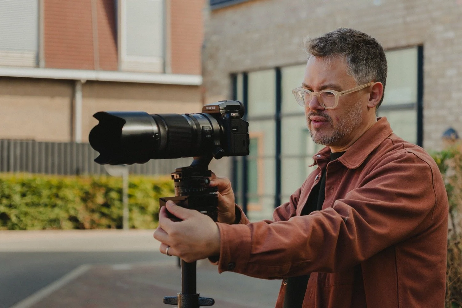Architectural photographer Matthew Smith checking a composition through his camera