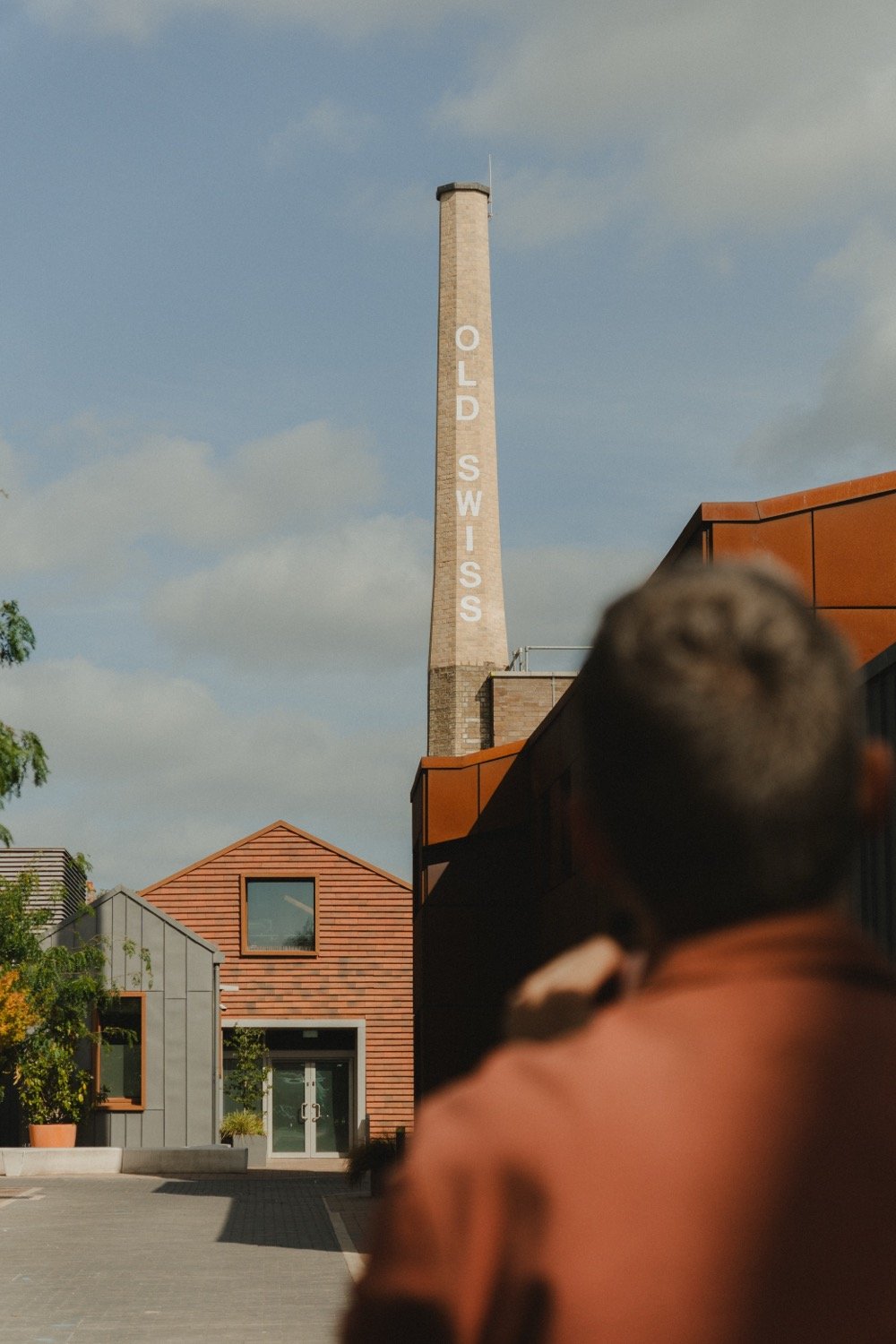 Matthew Smith framing the old laundry chimney at Old Swiss, Cherry Hinton Road, Cambridge