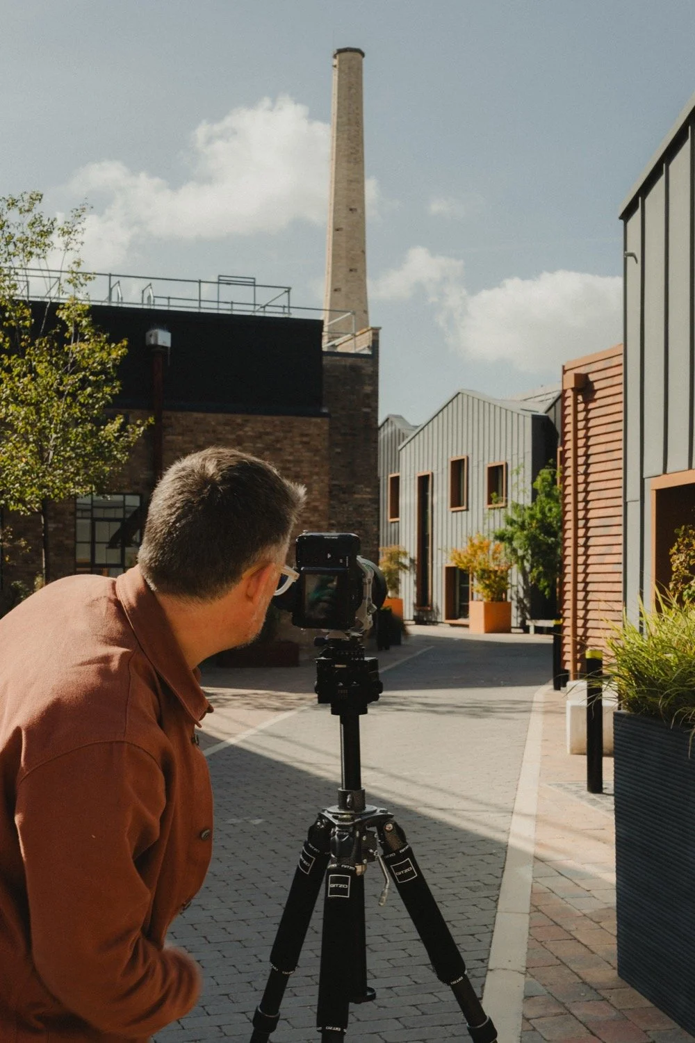 Over-the-shoulder view of Matthew Smith shooting towards the Swiss Laundry chimney