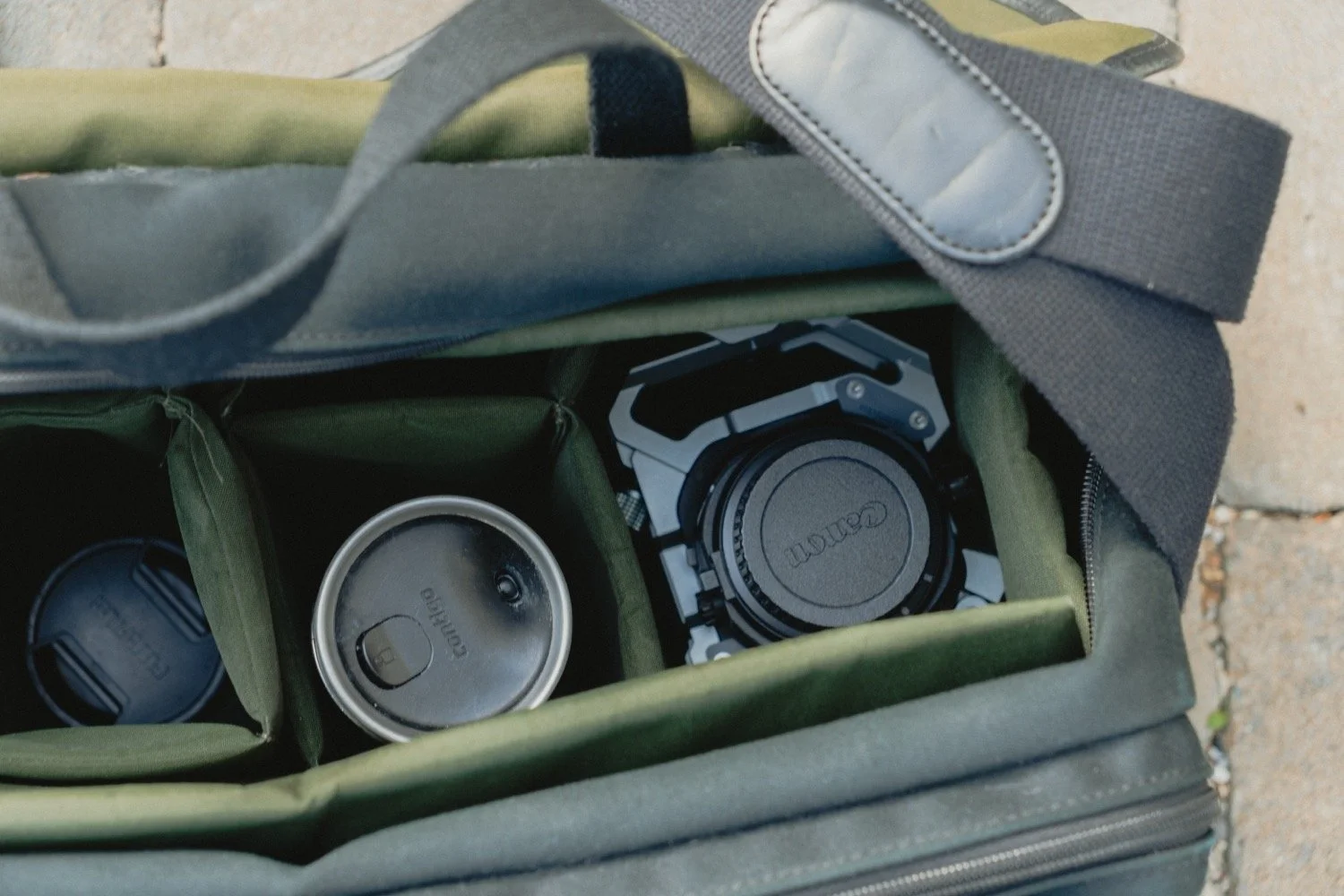 Detail of an architectural photographer’s camera bag, lenses and kit