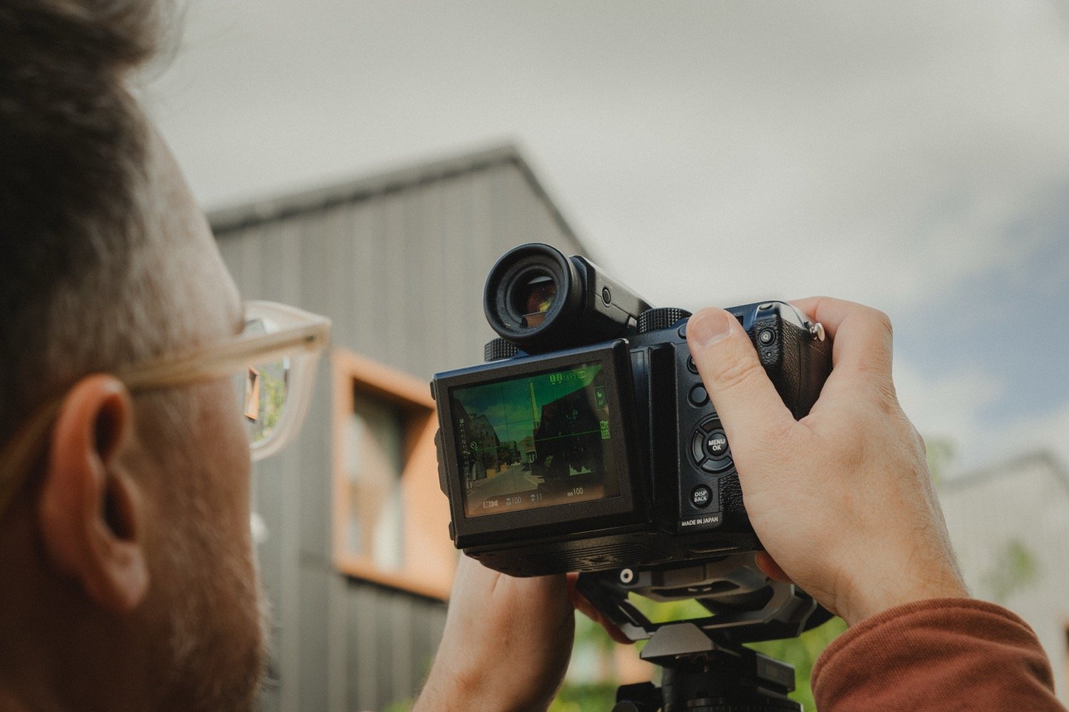 Matthew Smith’s camera screen showing a composition of a timber-clad building