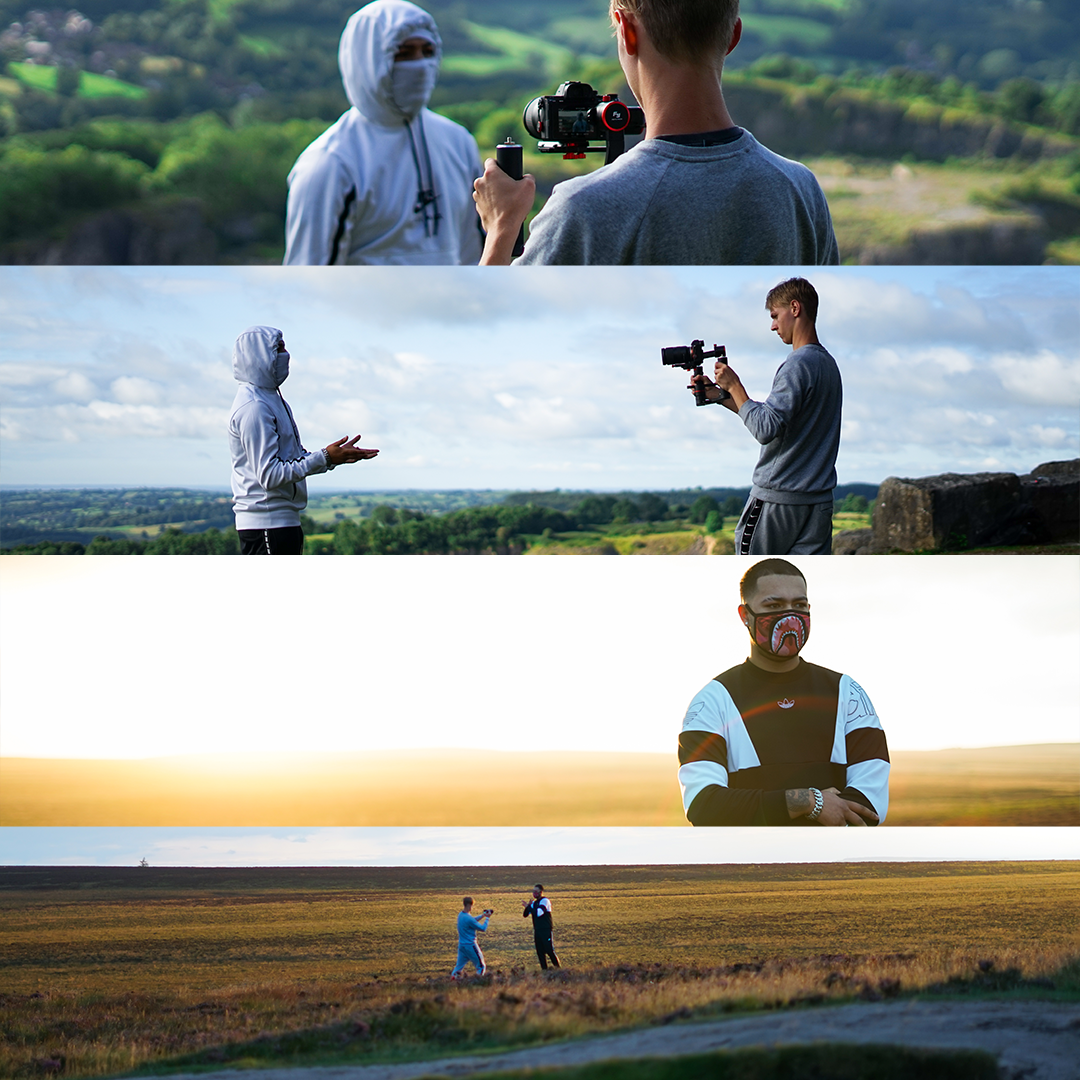 A collage of four images showing people filming outside. The first image shows a person in a gray shirt filming another person in a white hoodie with a mask, against a green landscape. The second image shows a person in a white hoodie filming a person in a gray sweater with a camera on a gimbal, with a cloudy sky and green landscape. The third image shows a person wearing a face mask and black and white jacket, standing with a sunset in the background. The fourth image shows two people in dark clothing standing on a field at sunset, with one holding a camera and the other appearing to be talking or directing.