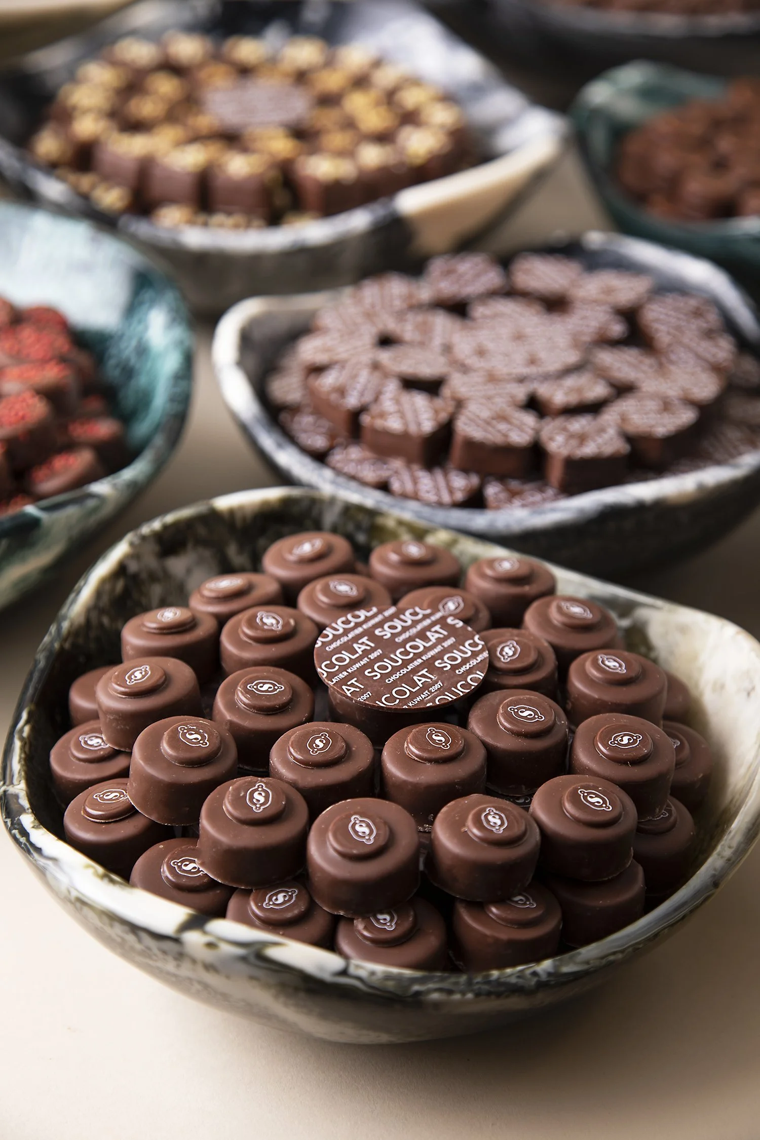 Various bowls of assorted chocolates
