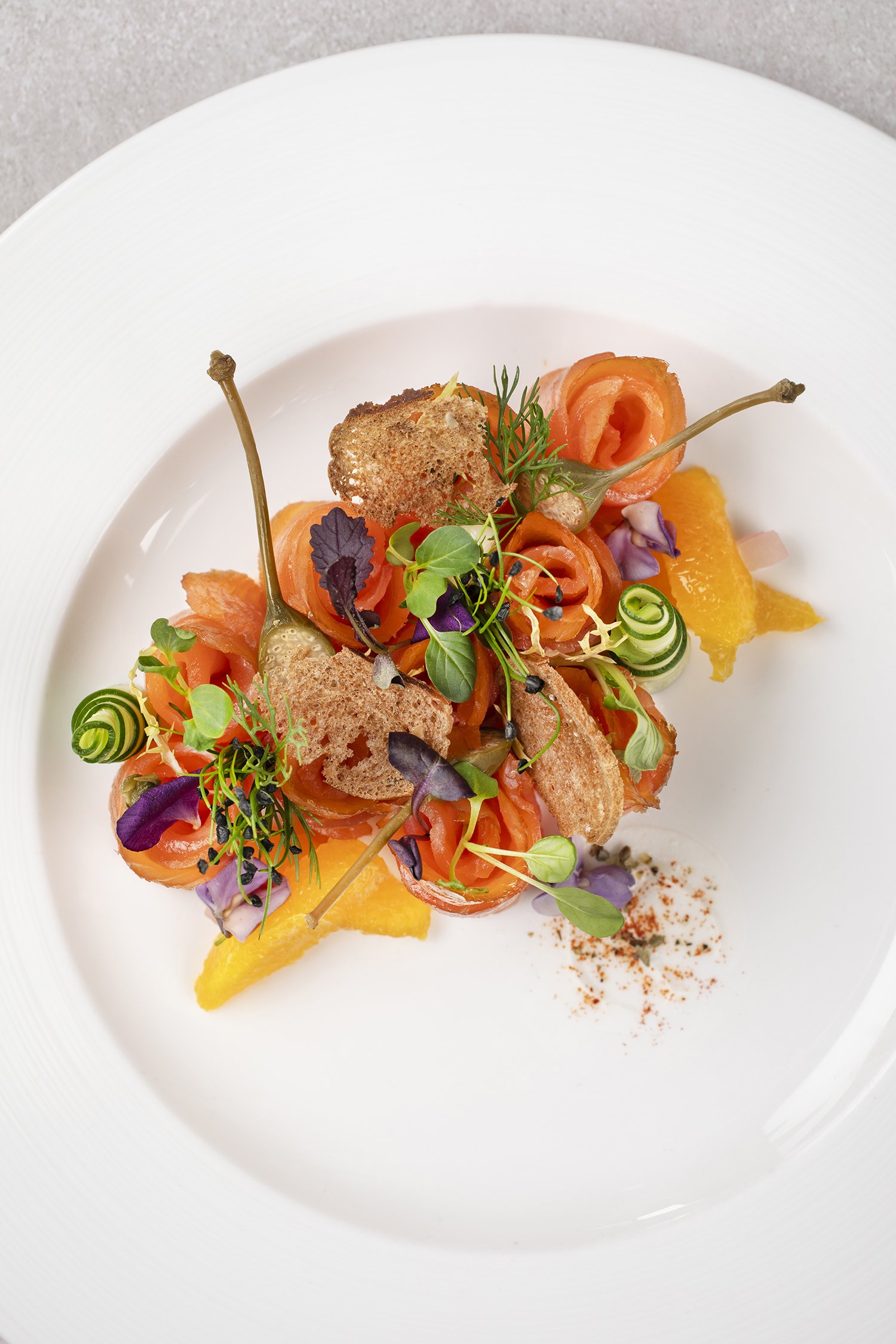 smoked salmon, microgreens, cucumber curls, orange segments, toasted bread crisps