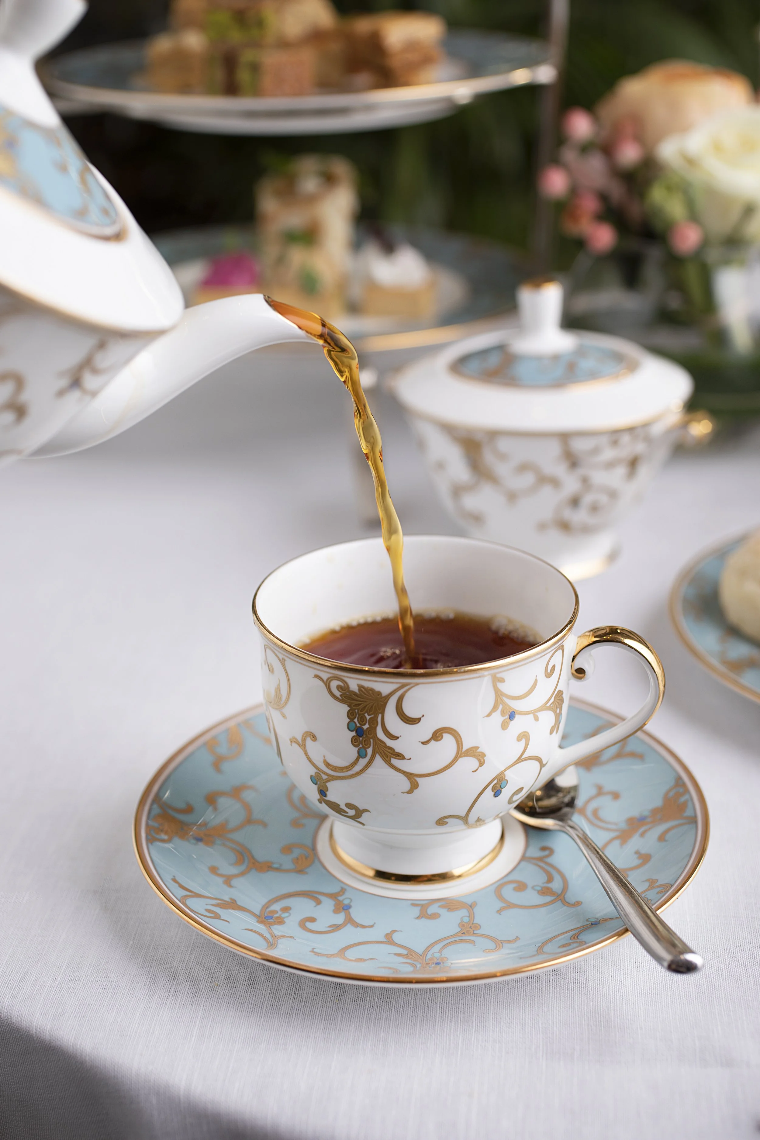 A teacup with gold and blue decorative patterns