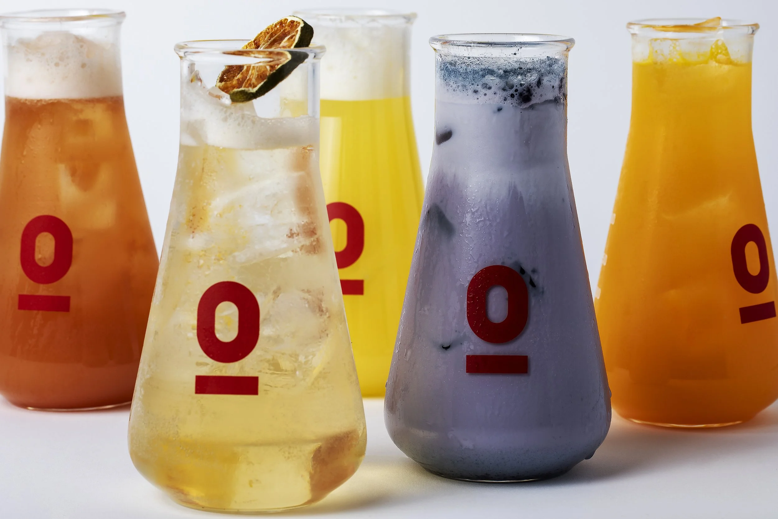 Five colorful glass bottles