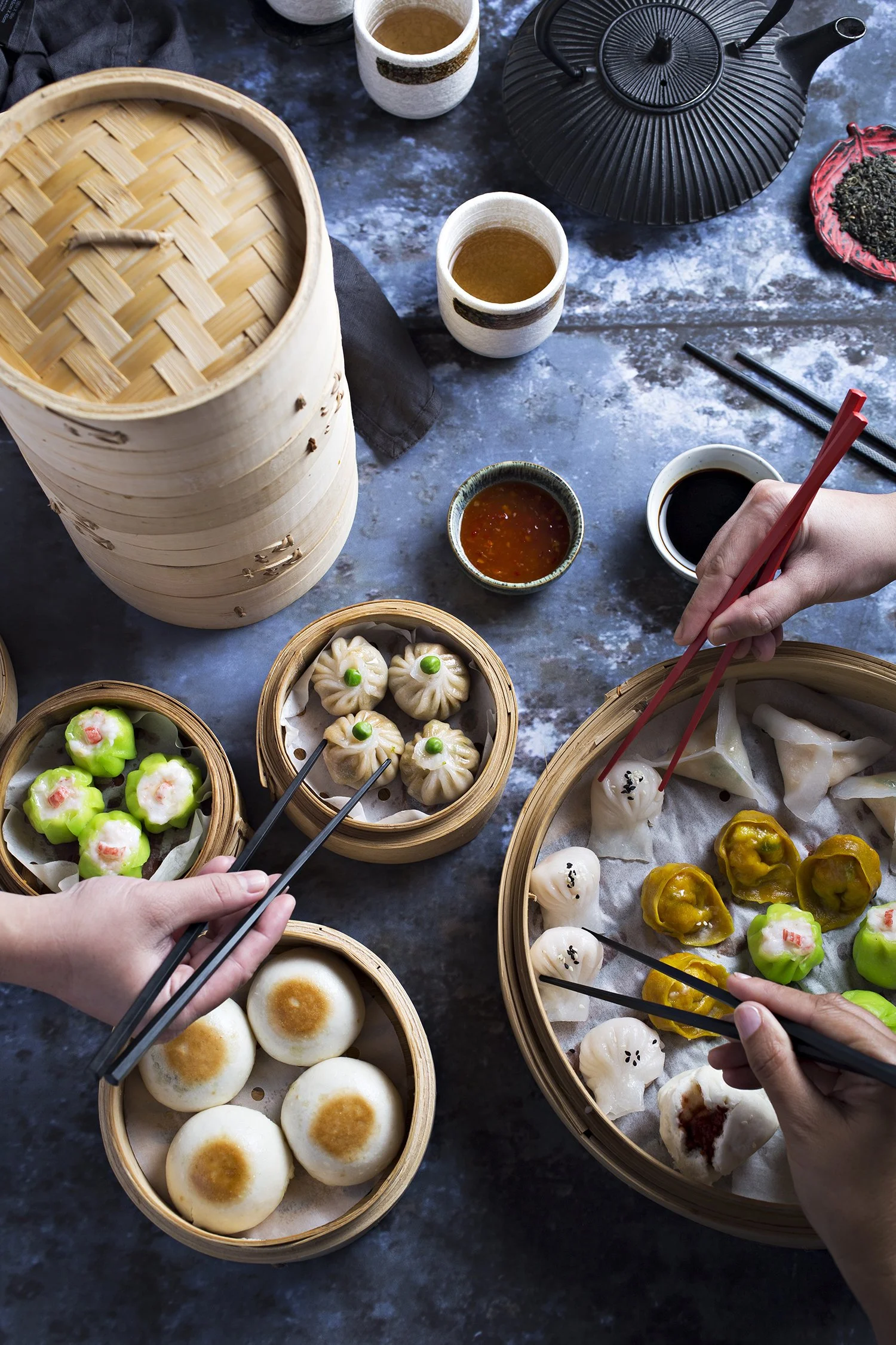 A variety of dim sum dishes in bamboo steamers 