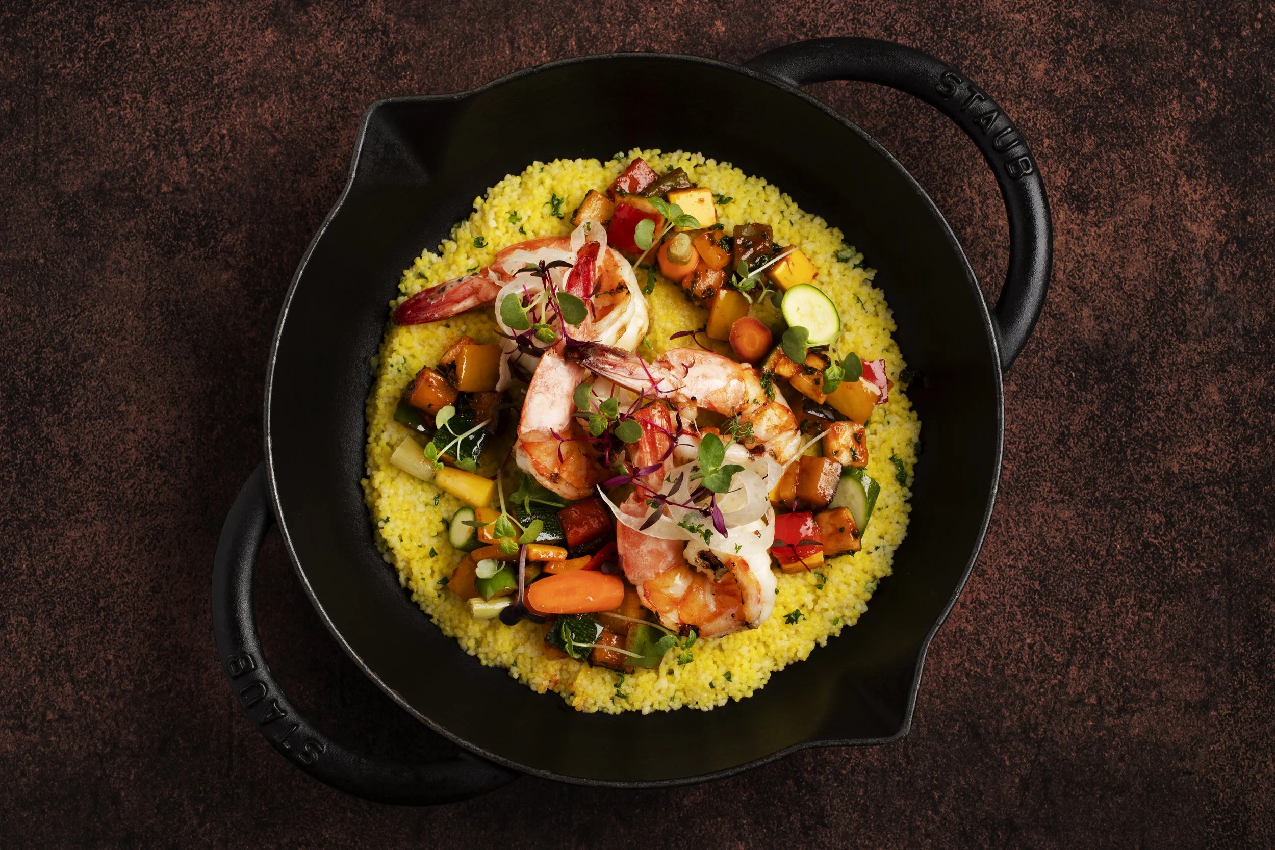 A black skillet with cooked shrimp, Jumeirah Messilah Beach
