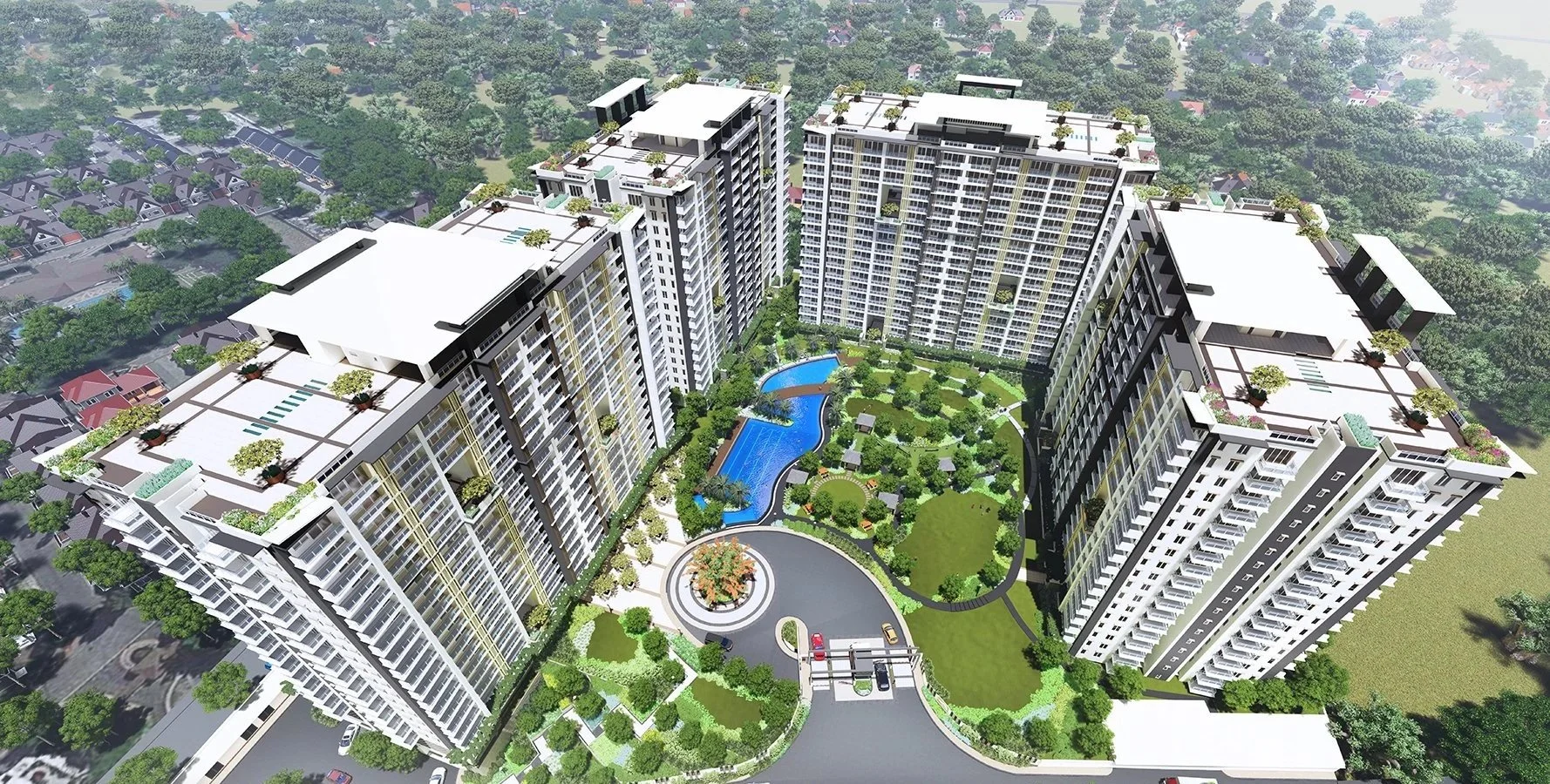 An aerial view of a modern residential complex with multiple tall apartment buildings surrounding a landscaped courtyard with a swimming pool, walking paths, greenery, and parking area.