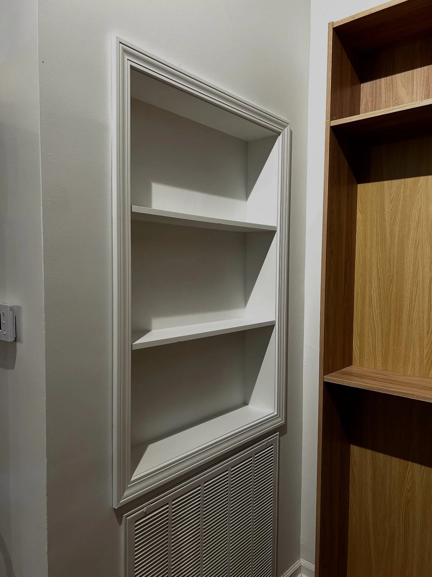 Our client expressed that they would love to be able to use this wall for product despite the necessity of the return air vent. One of our craftsmen said, &ldquo;No problem.&rdquo; 

Now, this wall not only houses product, but adds character to the s