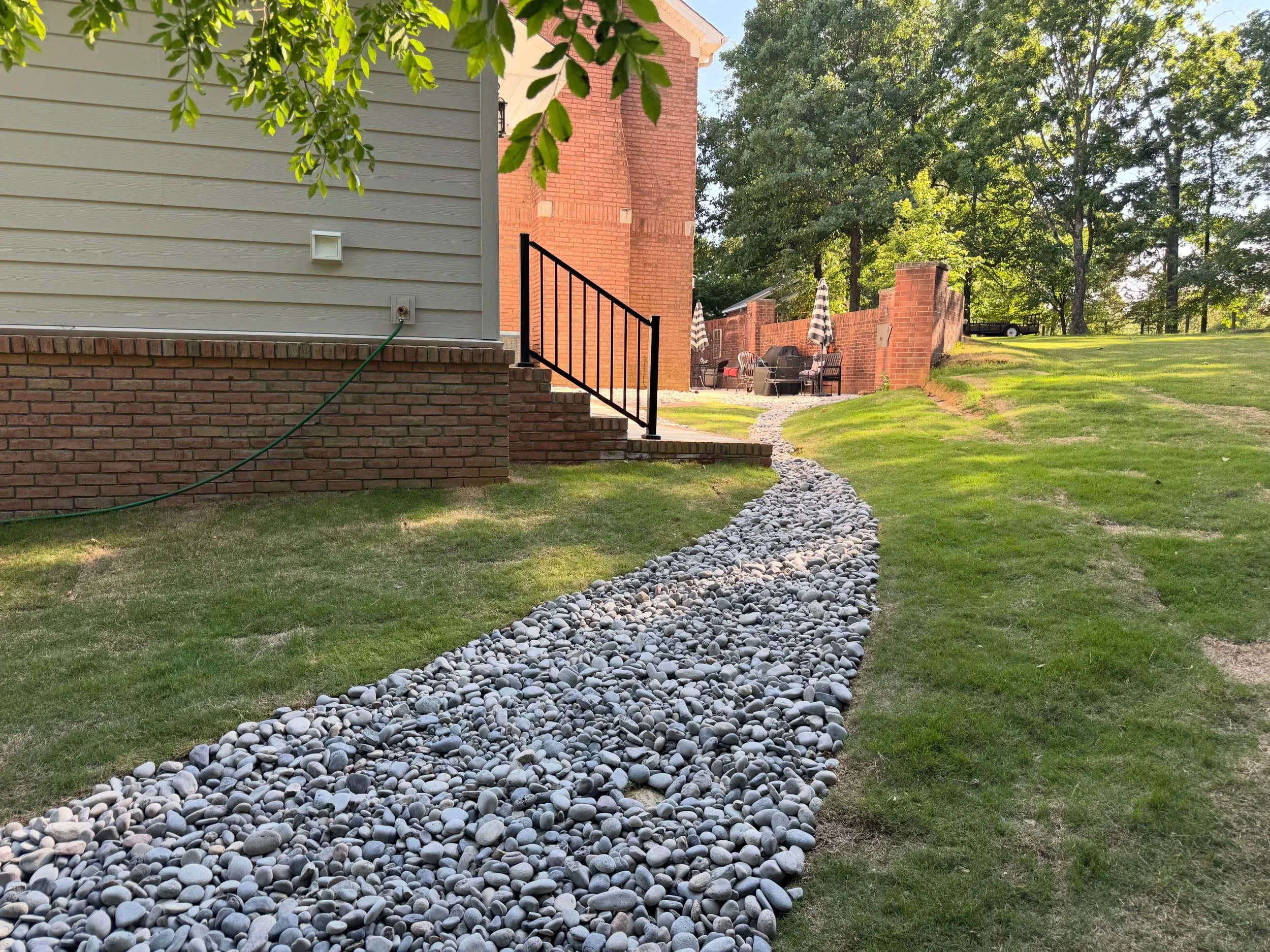 And just like that&hellip; it&rsquo;s May! 

The landscape of this backyard was a little tricky, but nothing we couldn&rsquo;t handle! We brought in rock that adds aesthetic intrigue and slows down the natural path of water&mdash;keeping the mud away