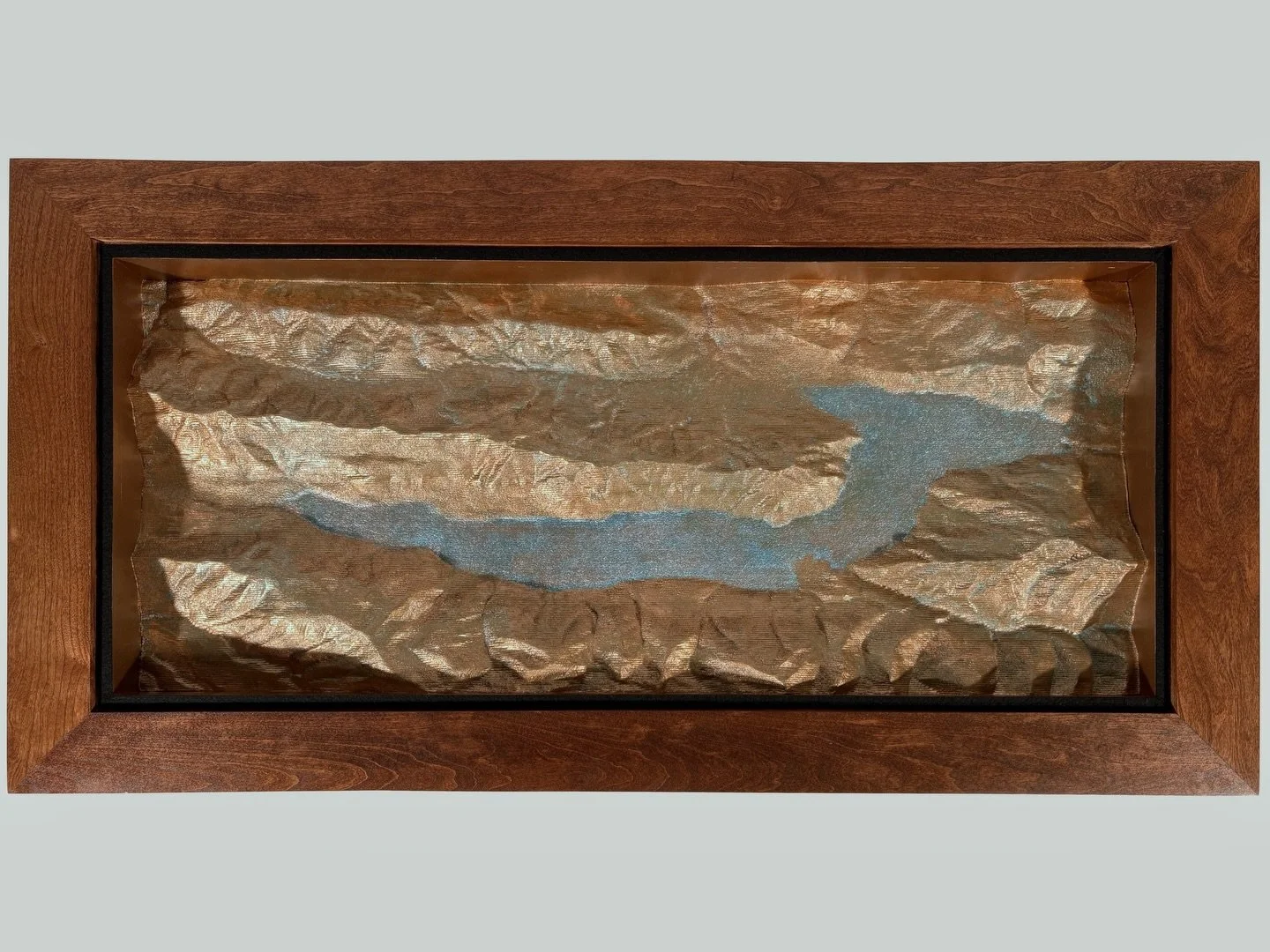 Project 042: Topo Table, Lake Crescent.

This topographic table features the terrain of Lake Crescent in Washington state. My client wanted to display the natural beauty of this region and remind them of special memories made there. 

The topography 