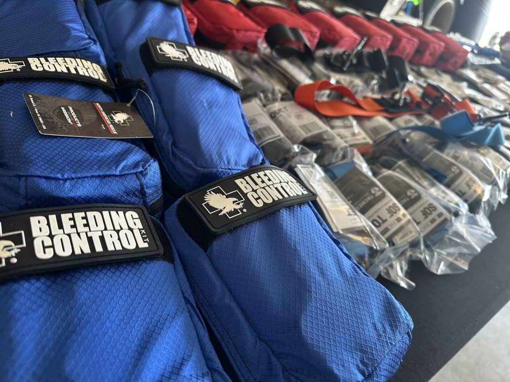Bleeding control kits and tourniquets laid out for class