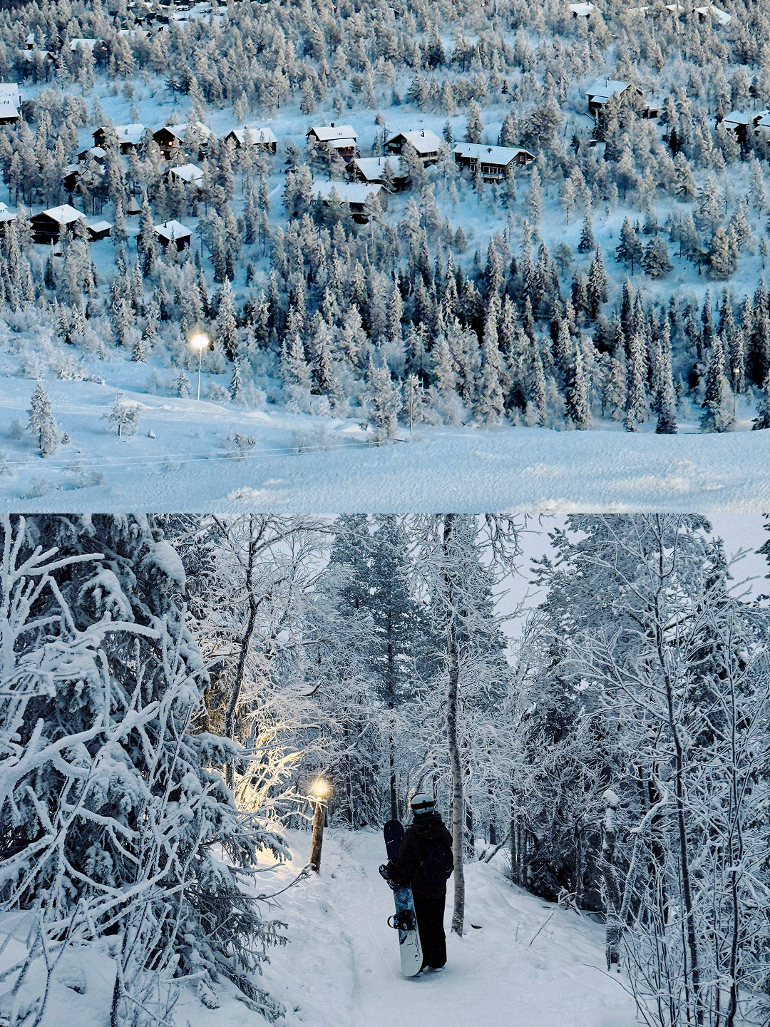 A snowy mountain village with houses and dense snow-covered trees in the background, and a person with a snowboard walking through a snowy forest trail at dusk in the foreground.