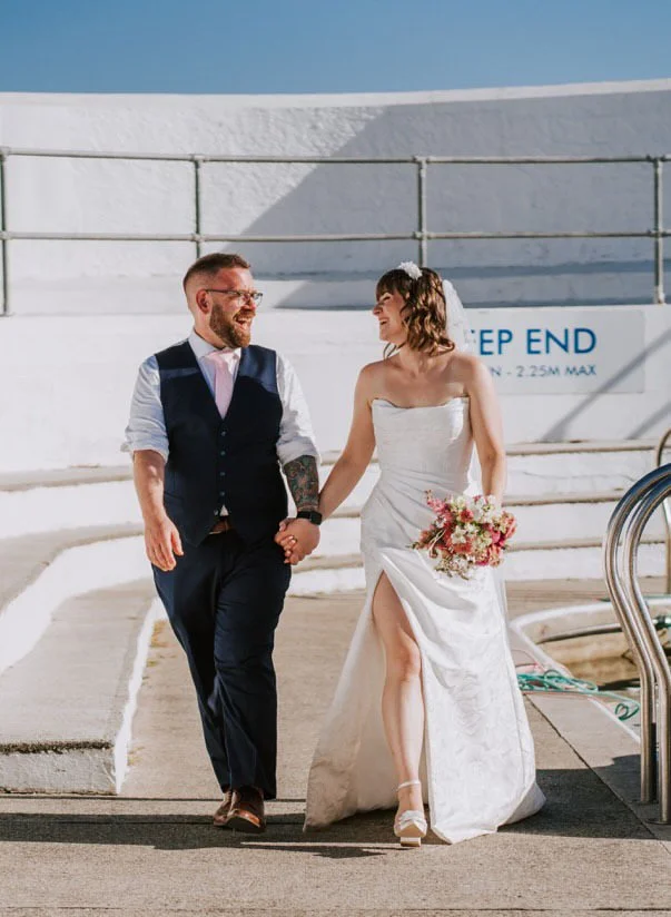 July 2025 Elopement with photos taken at jubilee pool Penzance, photography Arianna Fenton