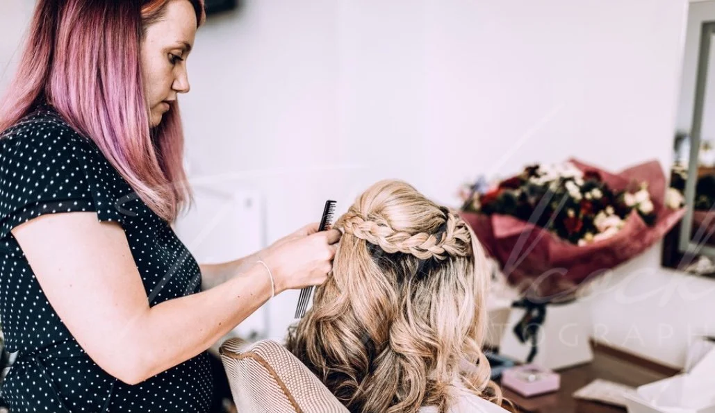 Finishing the bridal style . Photographed by Tim Woolcock