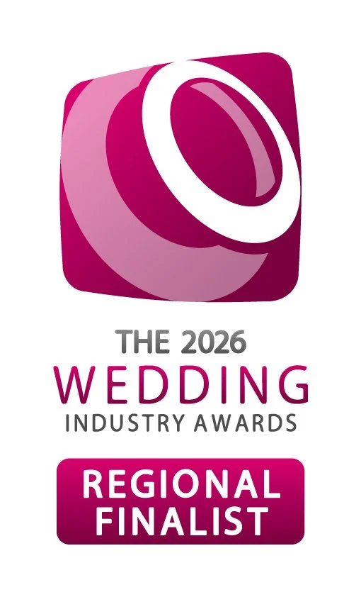 Logo for The 2026 Wedding Industry Awards with a stylized wedding ring icon and text indicating regional finalist status.