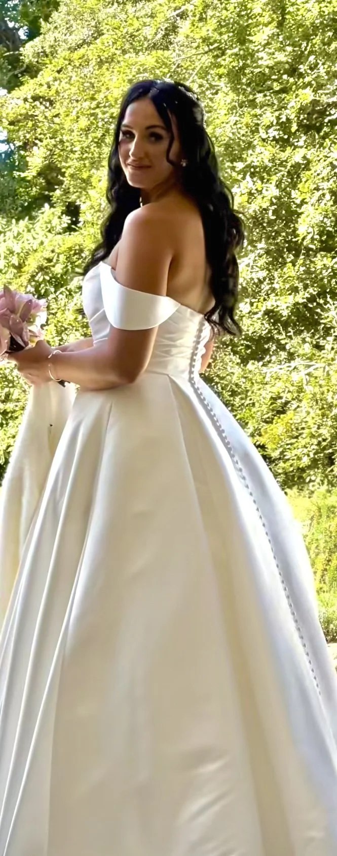 Tammie with a classic half up down style , soft waves finished with tiara vine