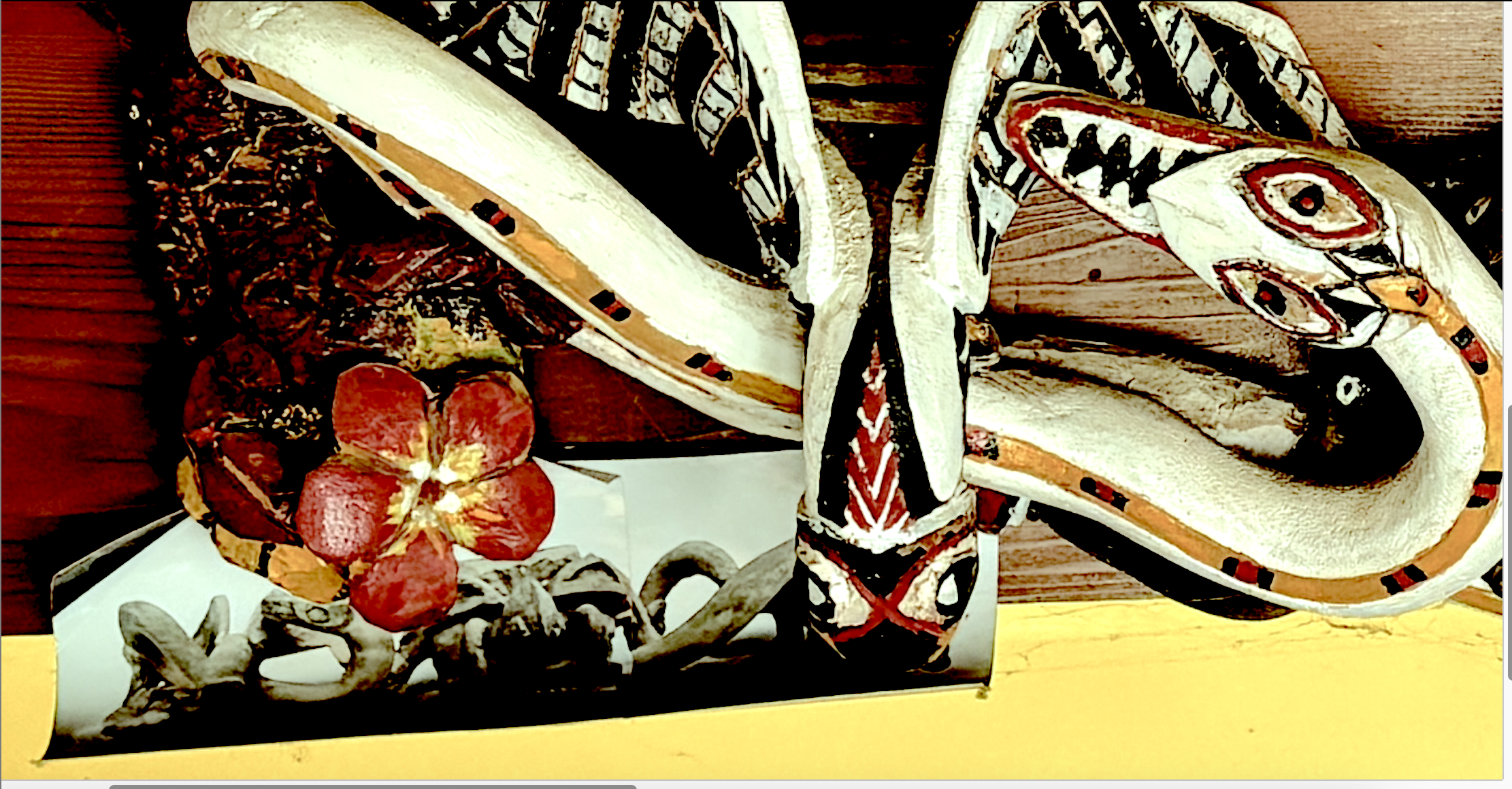 Traditional Wanryu ceremonial mask hand-carved by Bill Hochhausen featuring looping snake motifs.png