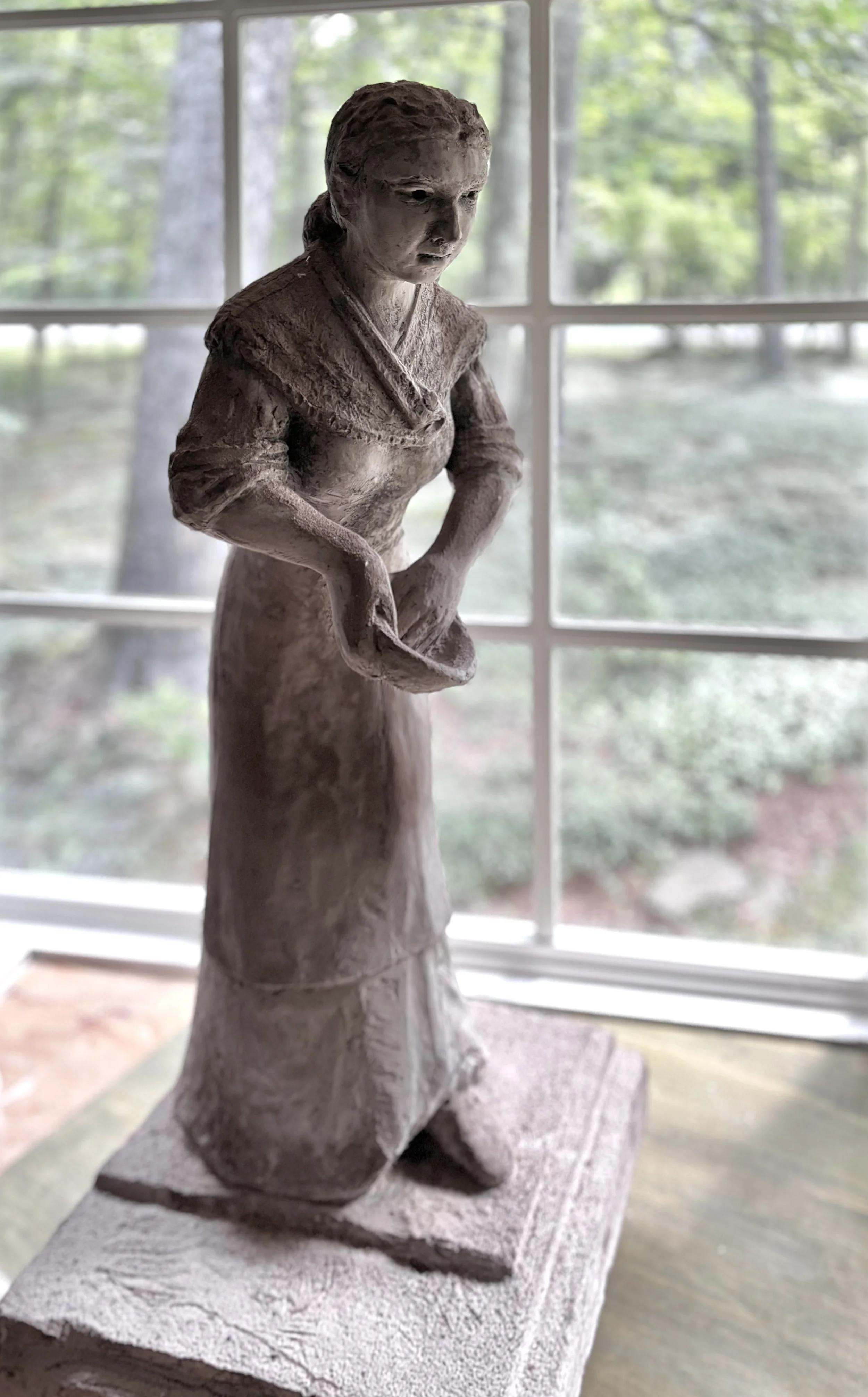 Hydrocal sculpture of a woman by Bill Hochhausen with expressive figurative form