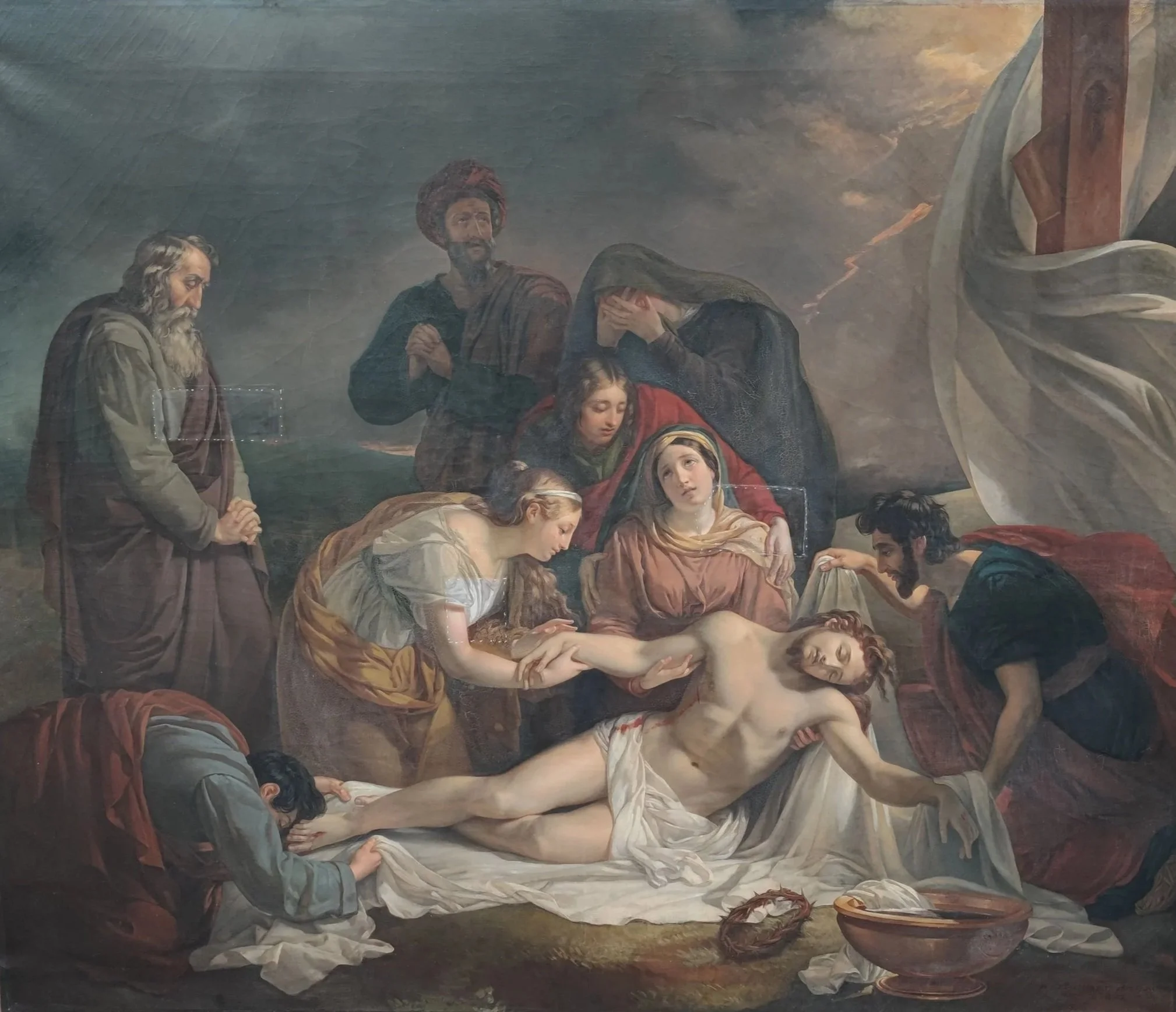 Une peinture religieuse représentant la mise au tombeau de Jésus-Christ, avec plusieurs figures pleurant et rendant hommage à son corps.