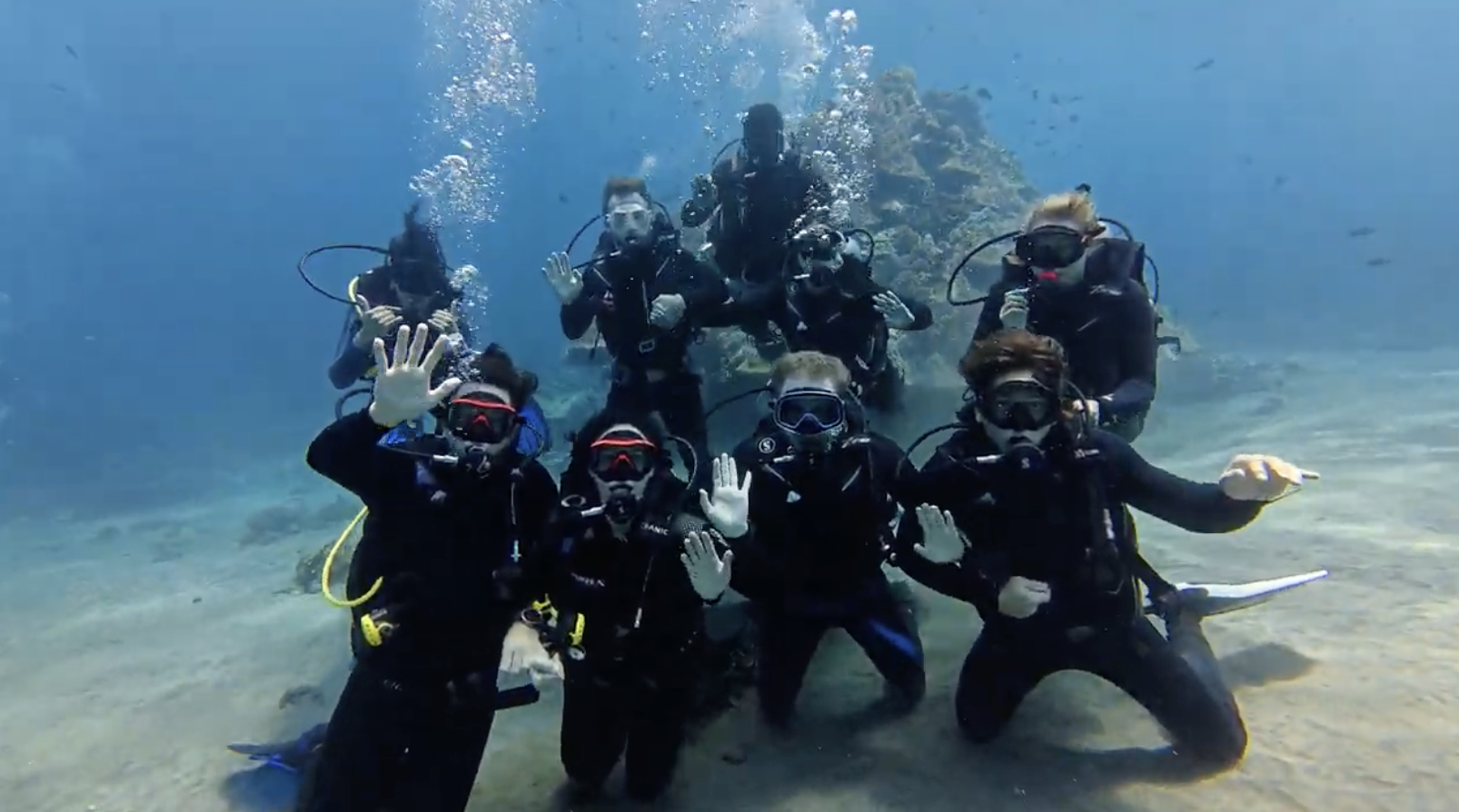 Our September 2026 group saying hi to the camera underwater!