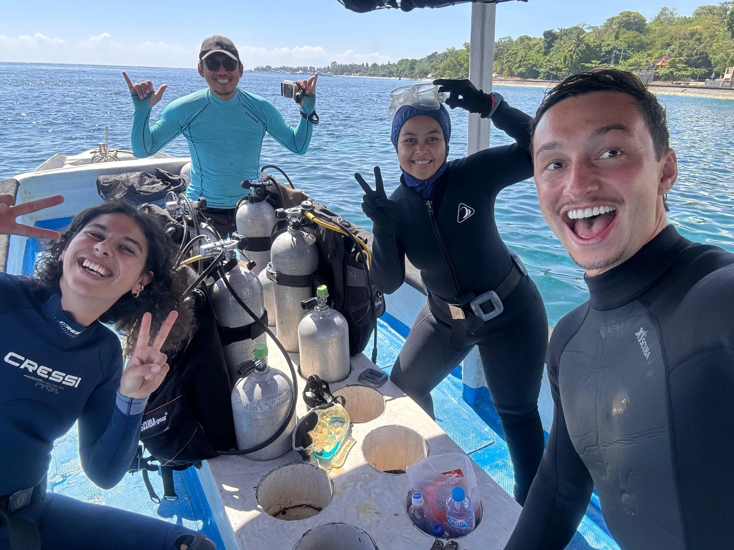A group of happy guests on the boat in Indonesia