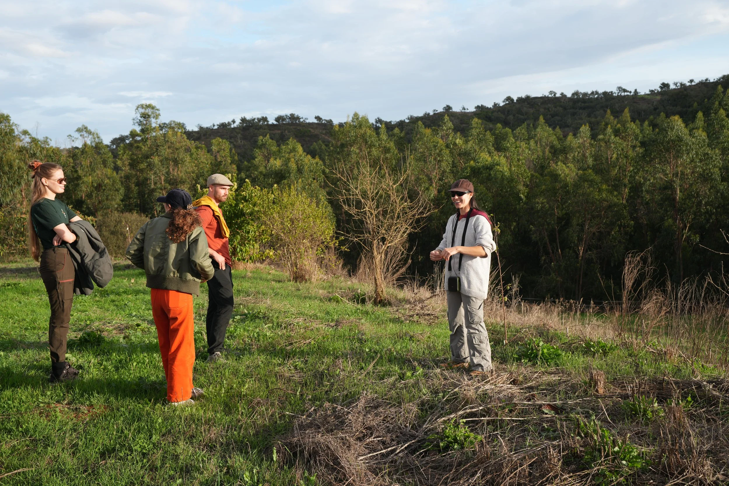 Teresa guiding a group through the land