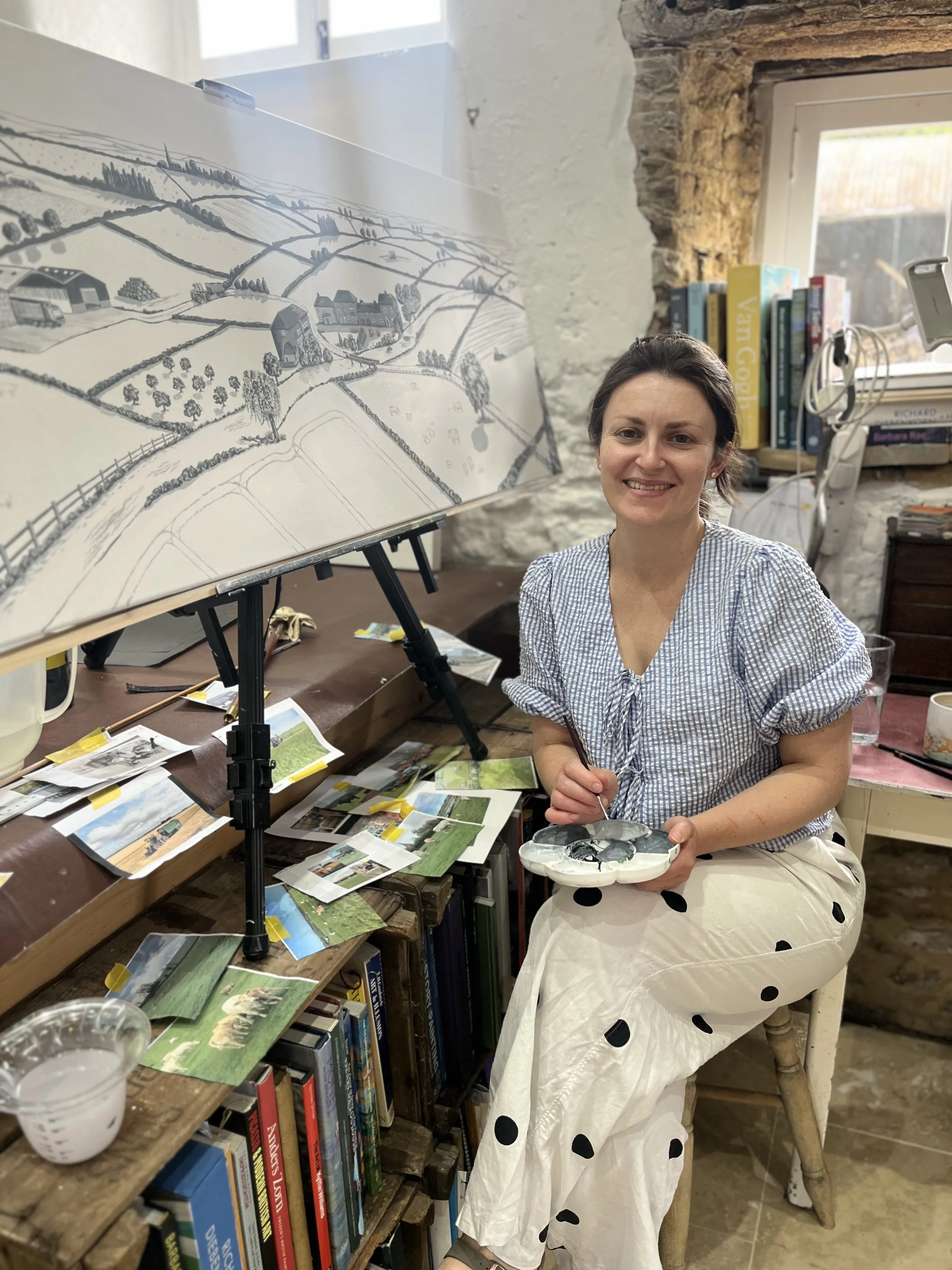 Nic Squires Artist painting farm landscape in studio