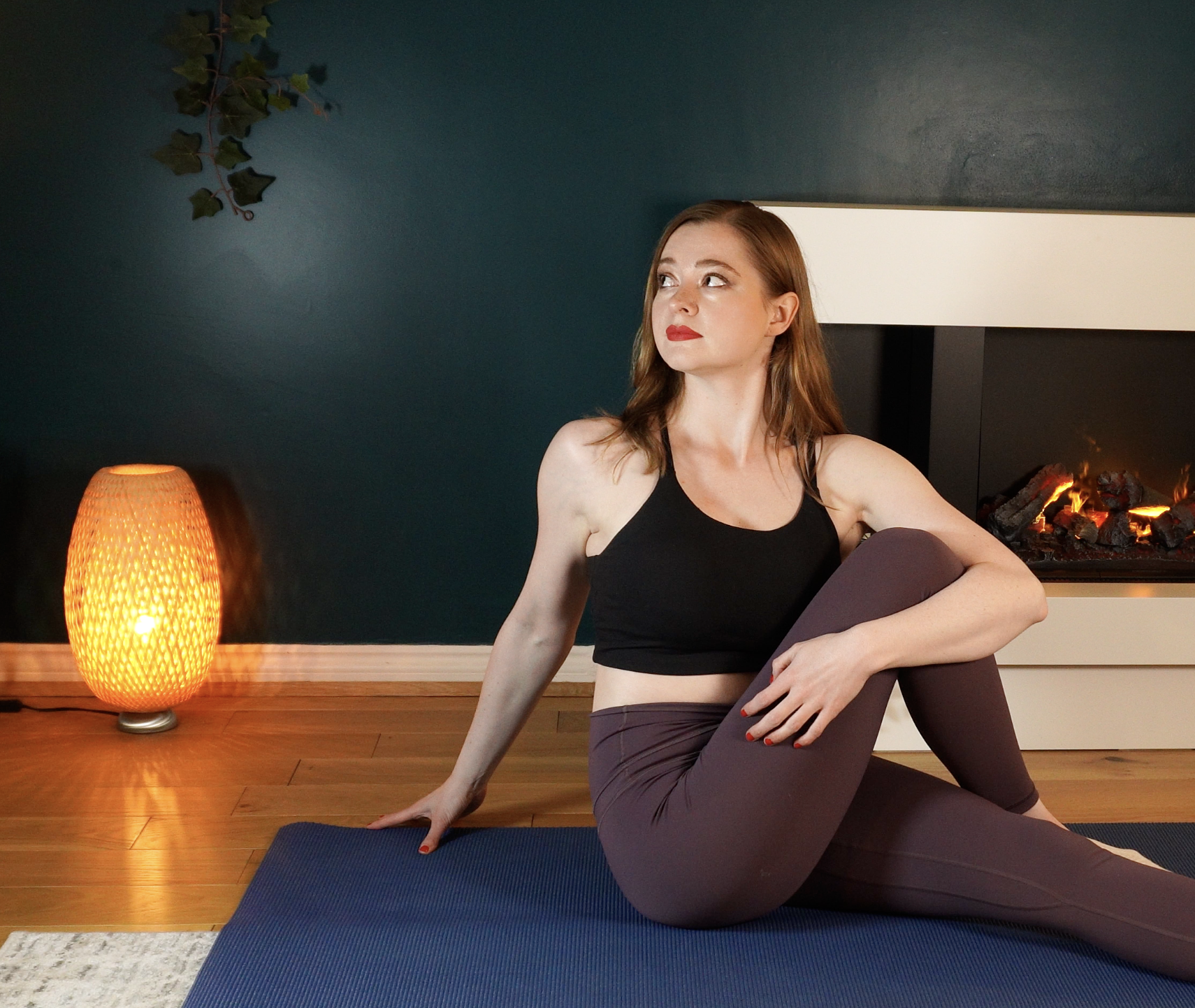 Jenn (Scottish Pilates teacher) demonstrating a back twist in her online Pilates prograamme designed for stiff backs & sore shoulders