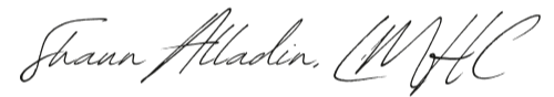 The image shows a faint handwritten signature on a white background.