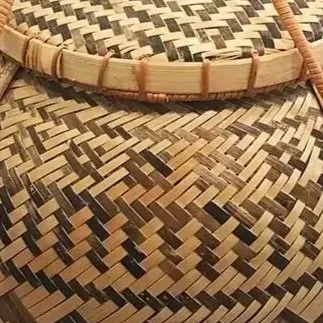 Close-up of woven rattan basket, showcasing intricate weaving pattern.