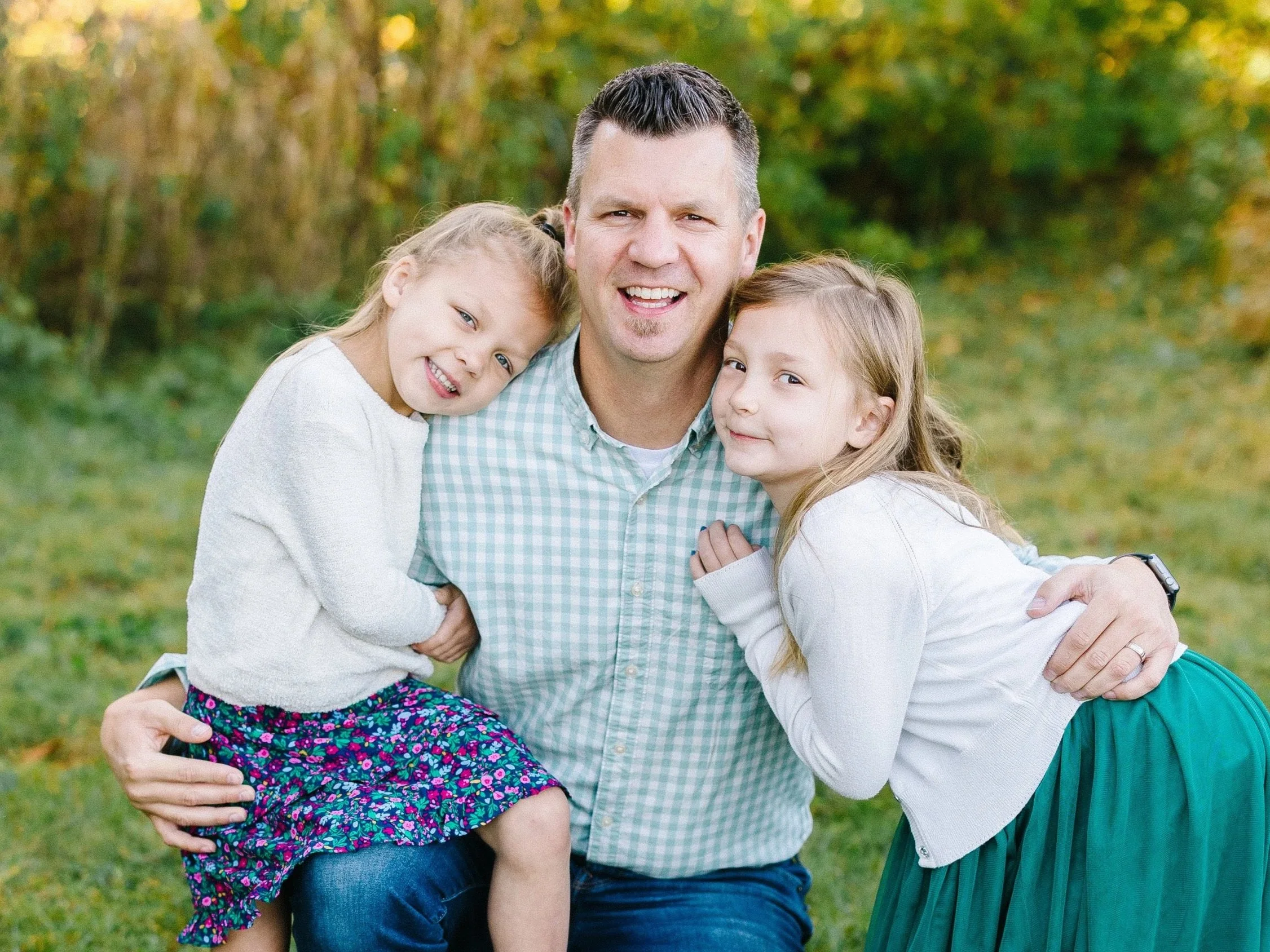 Travis and his girls love to laugh, learn, and play together.