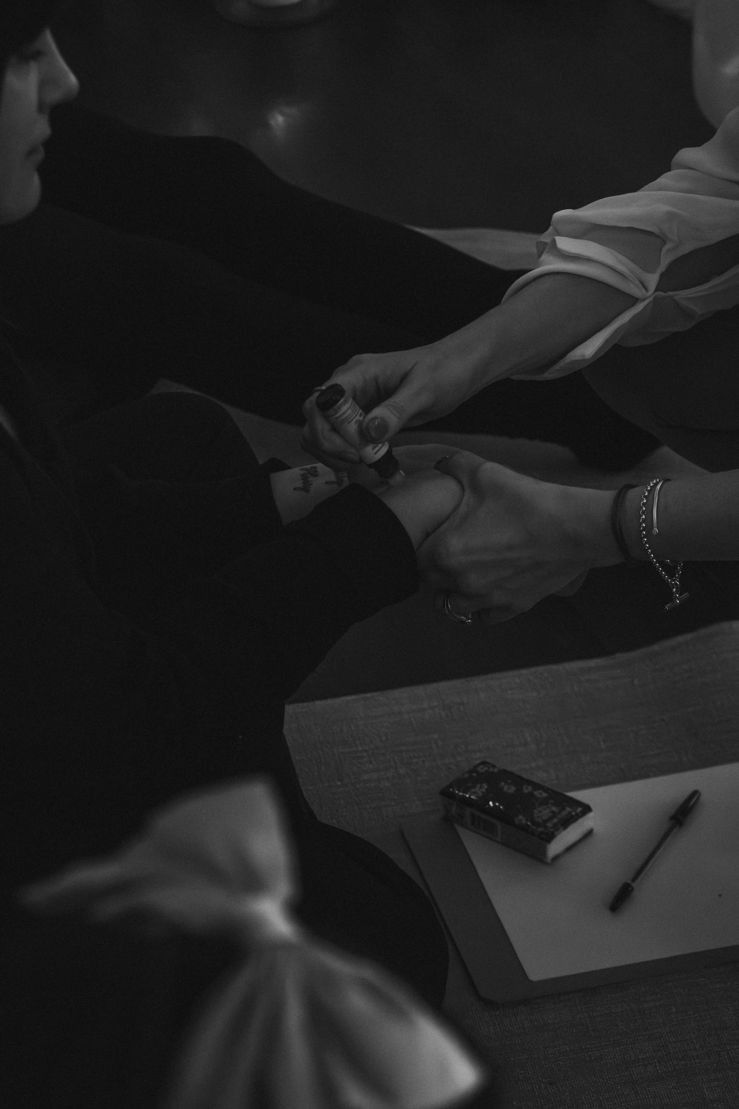 holistic retreat event, woman having rose oil placed on wrists