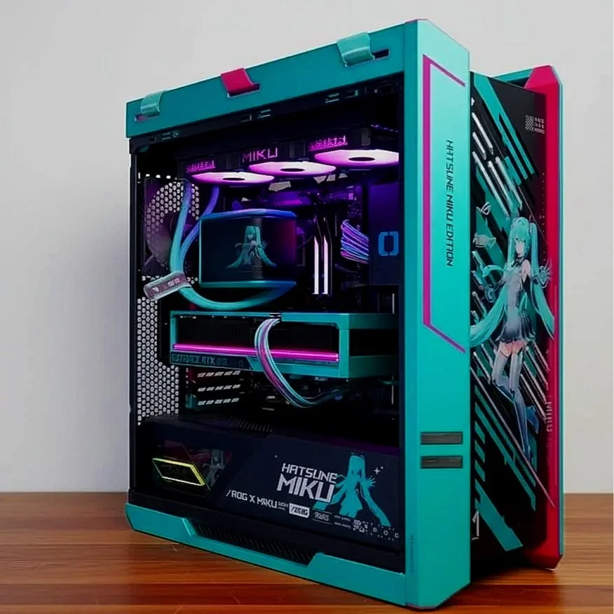 A custom gaming PC decorated with Hatsune Miku theme, featuring teal, pink, and purple lighting, and anime graphics on the case.