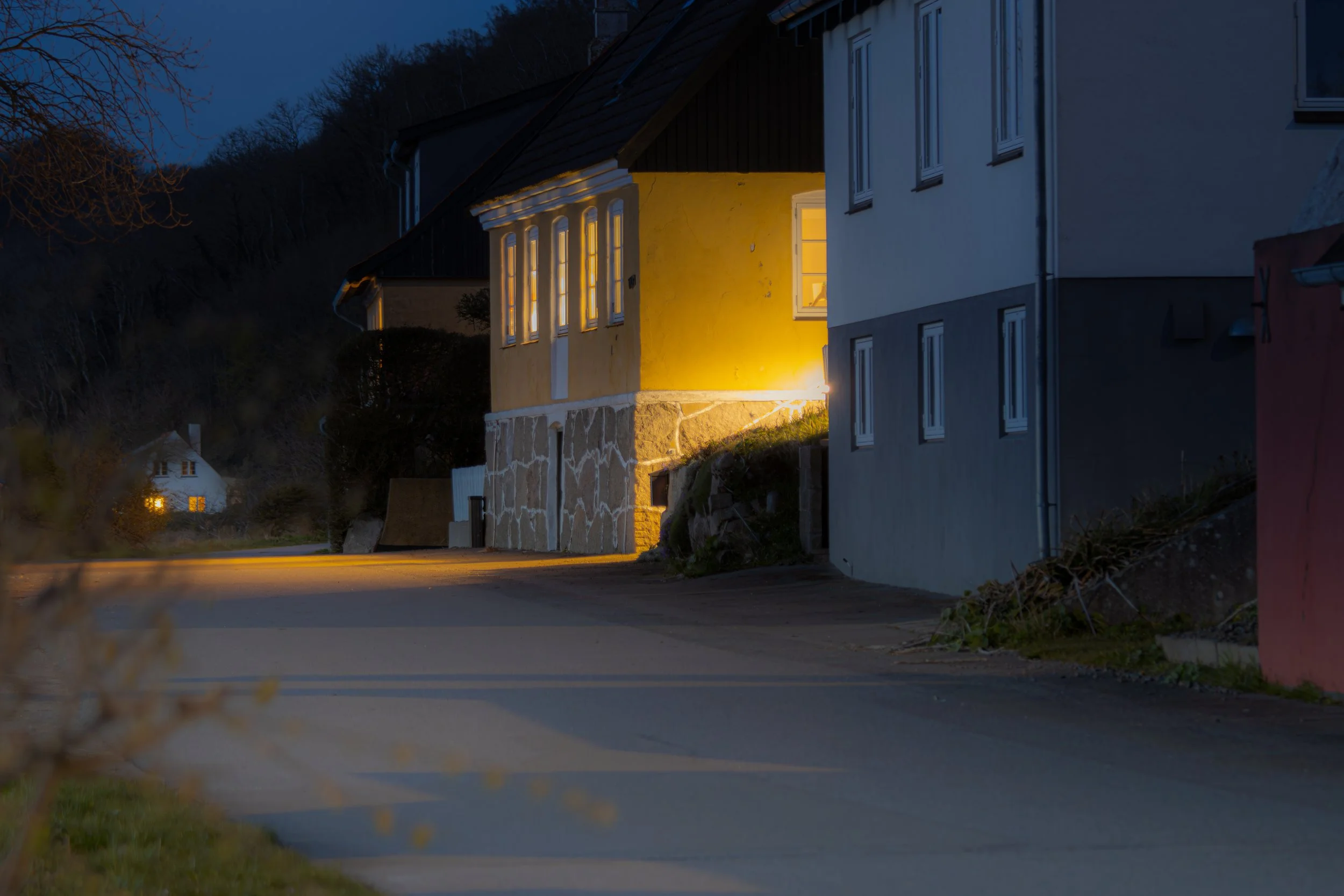 old houses by the sea at night