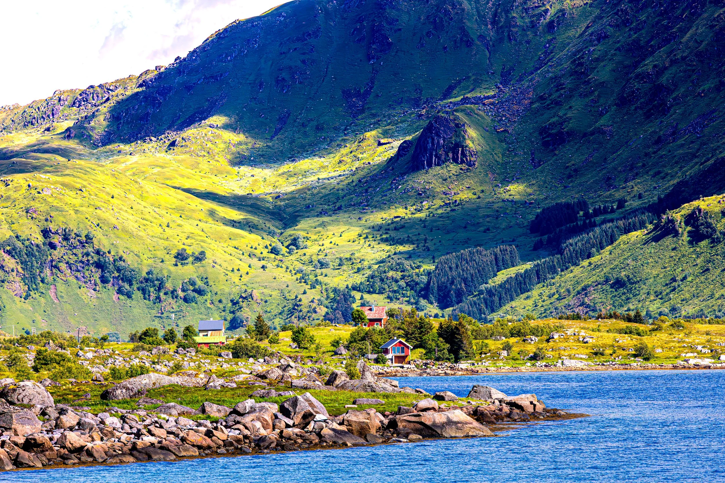Mountains at Lofoten islands and small houses by the ocean