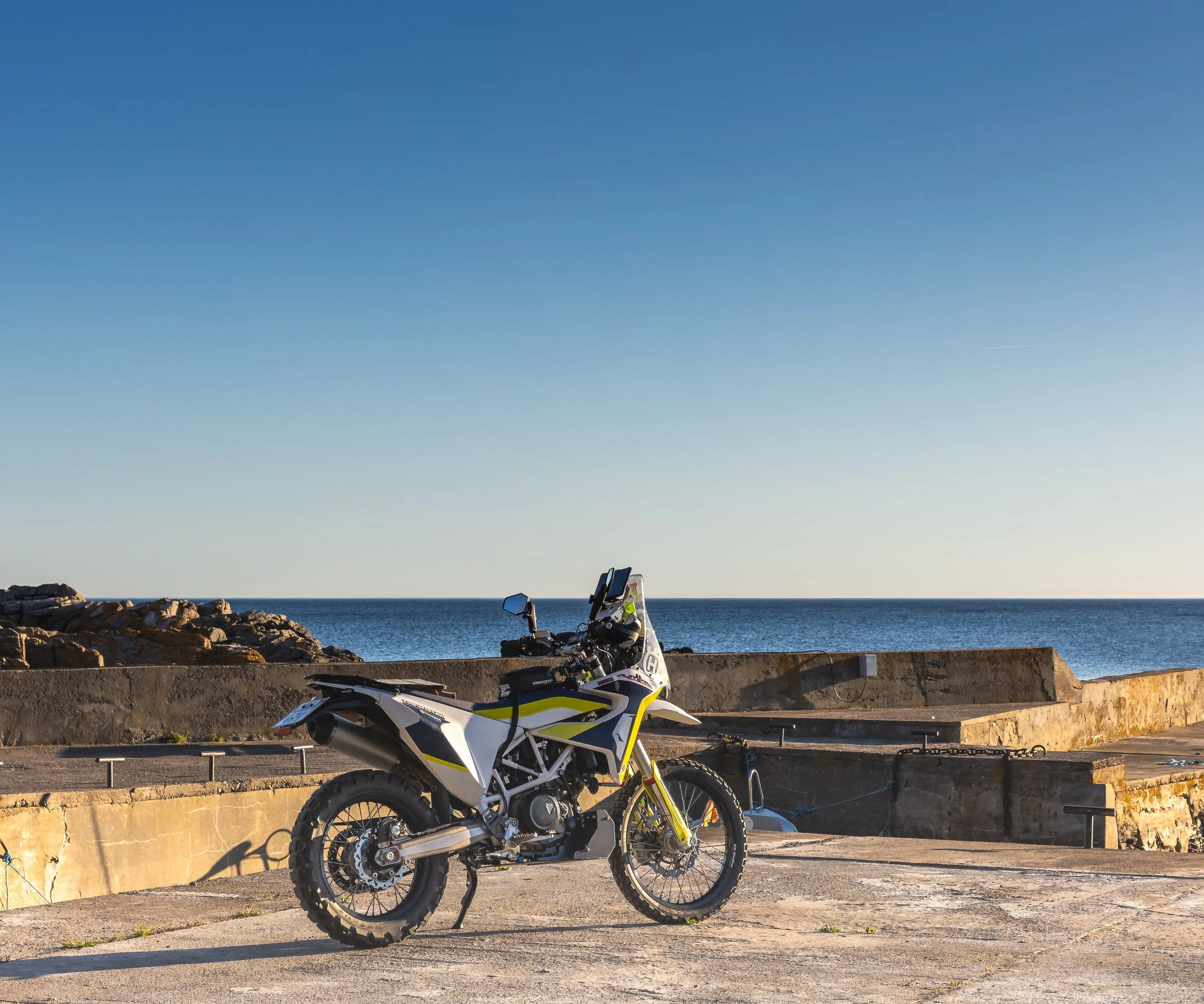 Husqvarna 701 parked at a pier