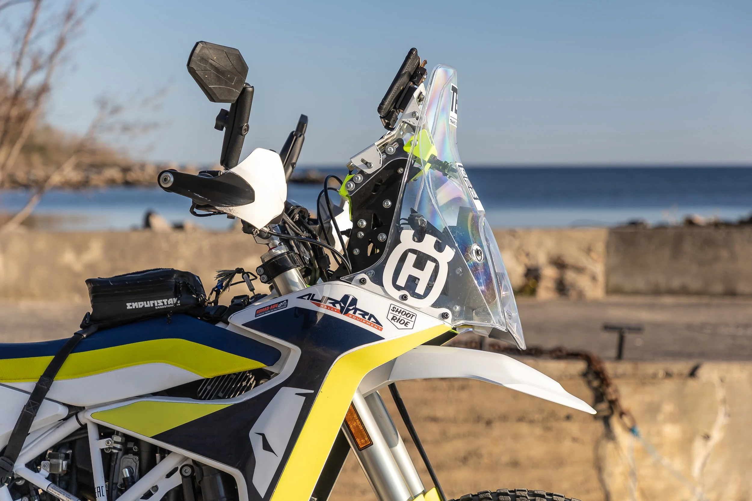 Aurora rally Husqvarna 701 parked at a pier