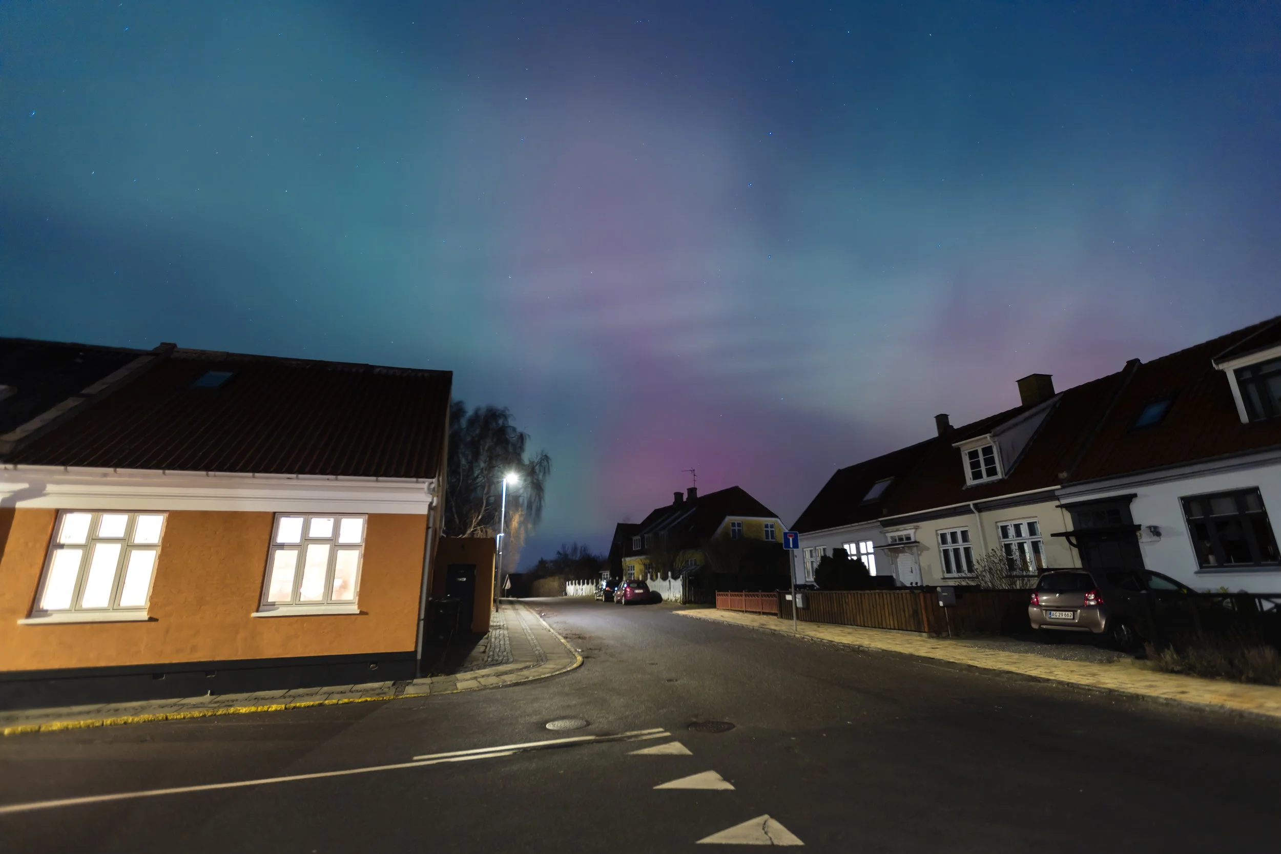 Aurora in a small town with houses